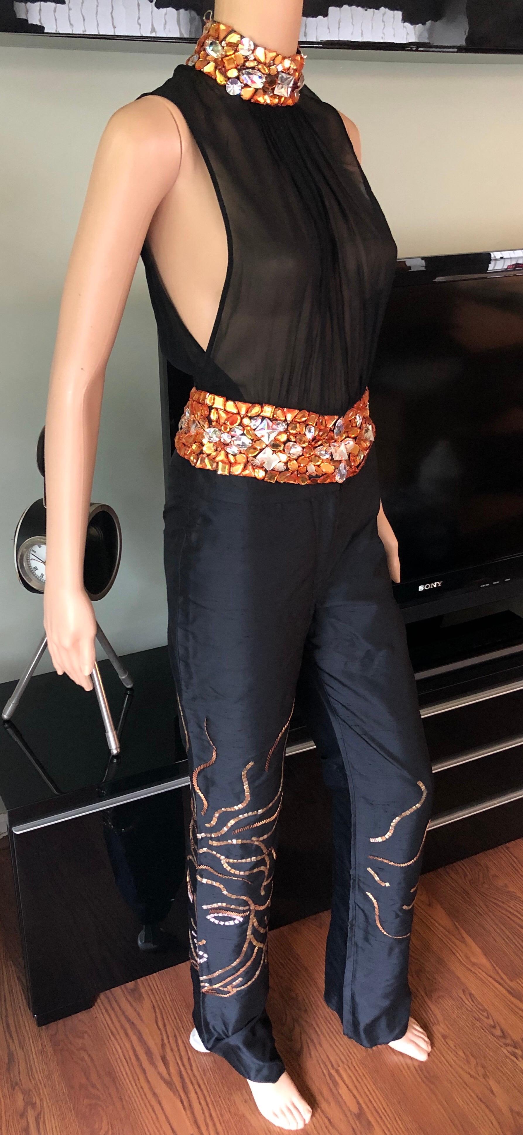Gianni Versace Couture S/S 2000 Runway Embellished Sheer Black Top and Pants 2 Piece Set 

Gianni Versace sheer mock neck top featuring crystal embellishments on neck and waist and button closure at back IT 40. Gianni Versace silk embellished pants