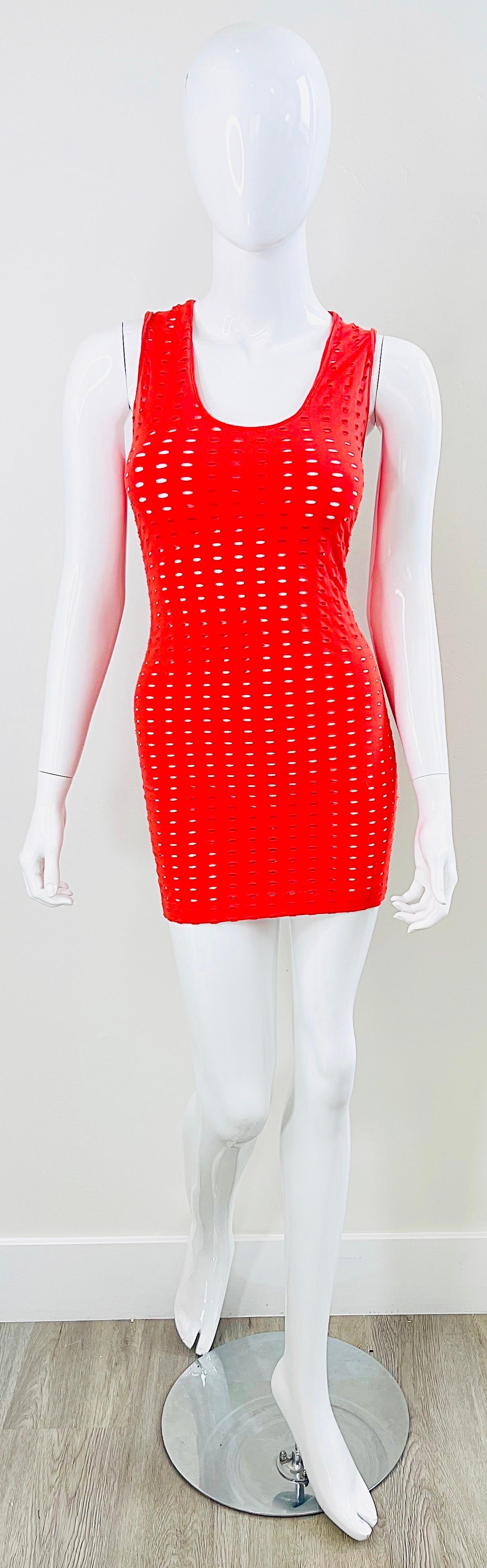 Sexy and collectible GIANNI VERSACE COUTURE S/S 2002 runway red cut-out dress ! Hidden zipper up the back with hook-and-eye closure. Stretch cotton fabric with cut-outs all over. Great belted or alone. The pictured black YSL belt is also available