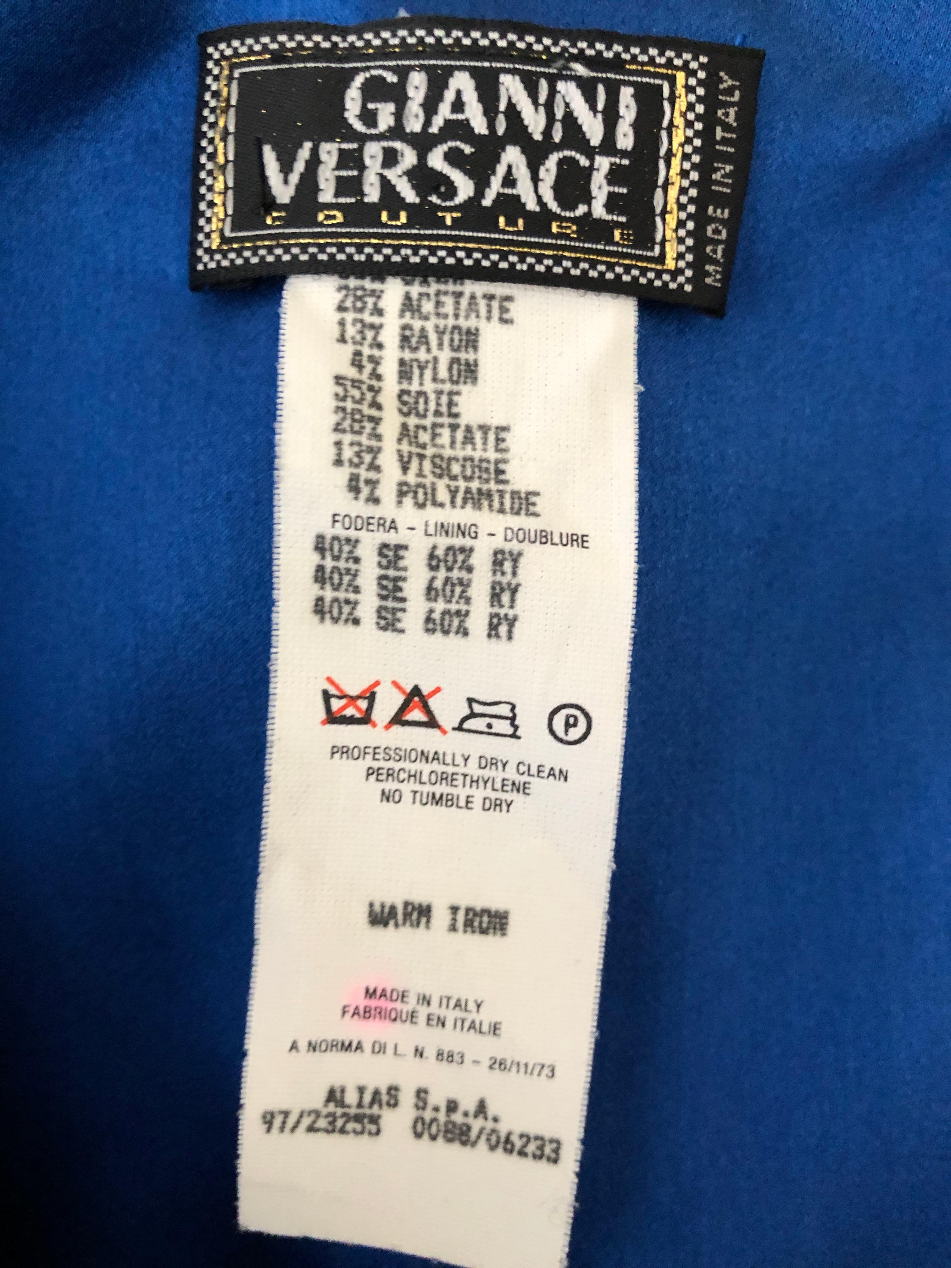 Gianni Versace Couture Vintage 80's Metallic Blue Evening Dress with Bugle Bead Details.
It's hard to describe the fabric, but it is much more brilliant in person, it shimmers.
Detailed with blue bugle beads, there are some beads missing on the