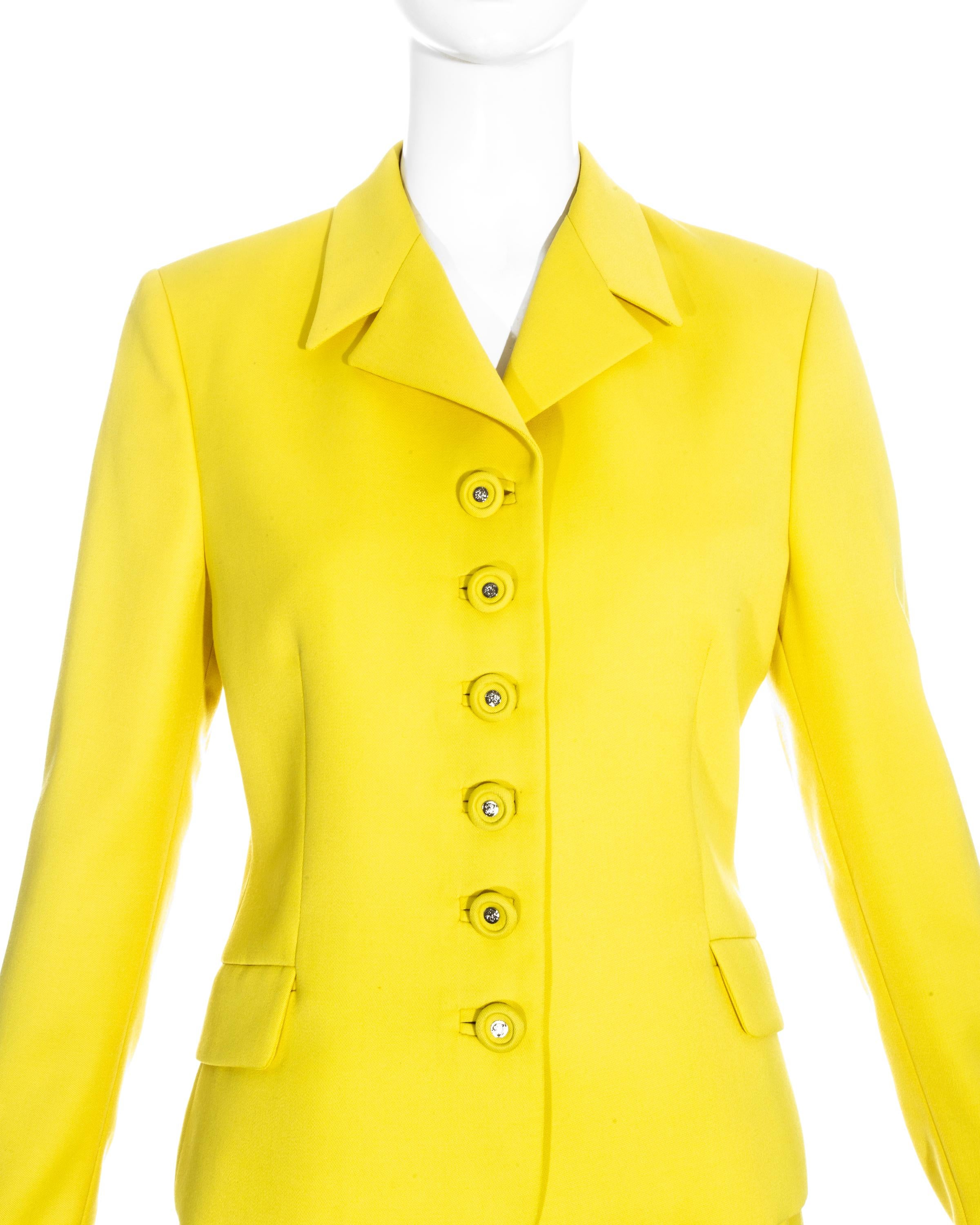 Bright yellow suit with mid-length skirt and single-breasted jacket with Medusa buttons by Gianni Versace

Spring-summer 1996