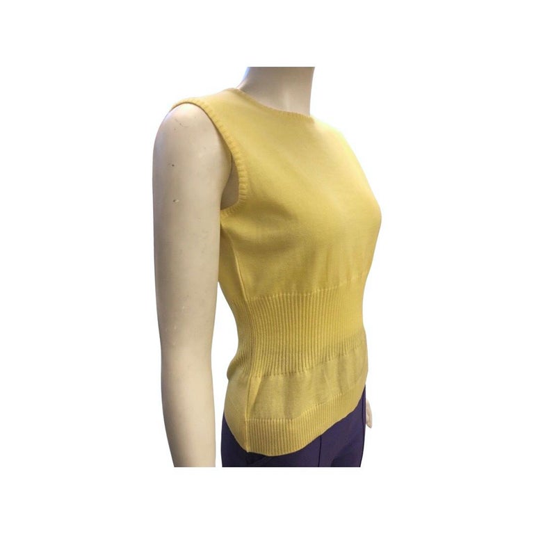 - Vintage 90s Gianni Versace Couture yellow wool sleeveless top. 

- Ribbed on the waist and hem. 

- Size 42. 

- 100% Wool 
