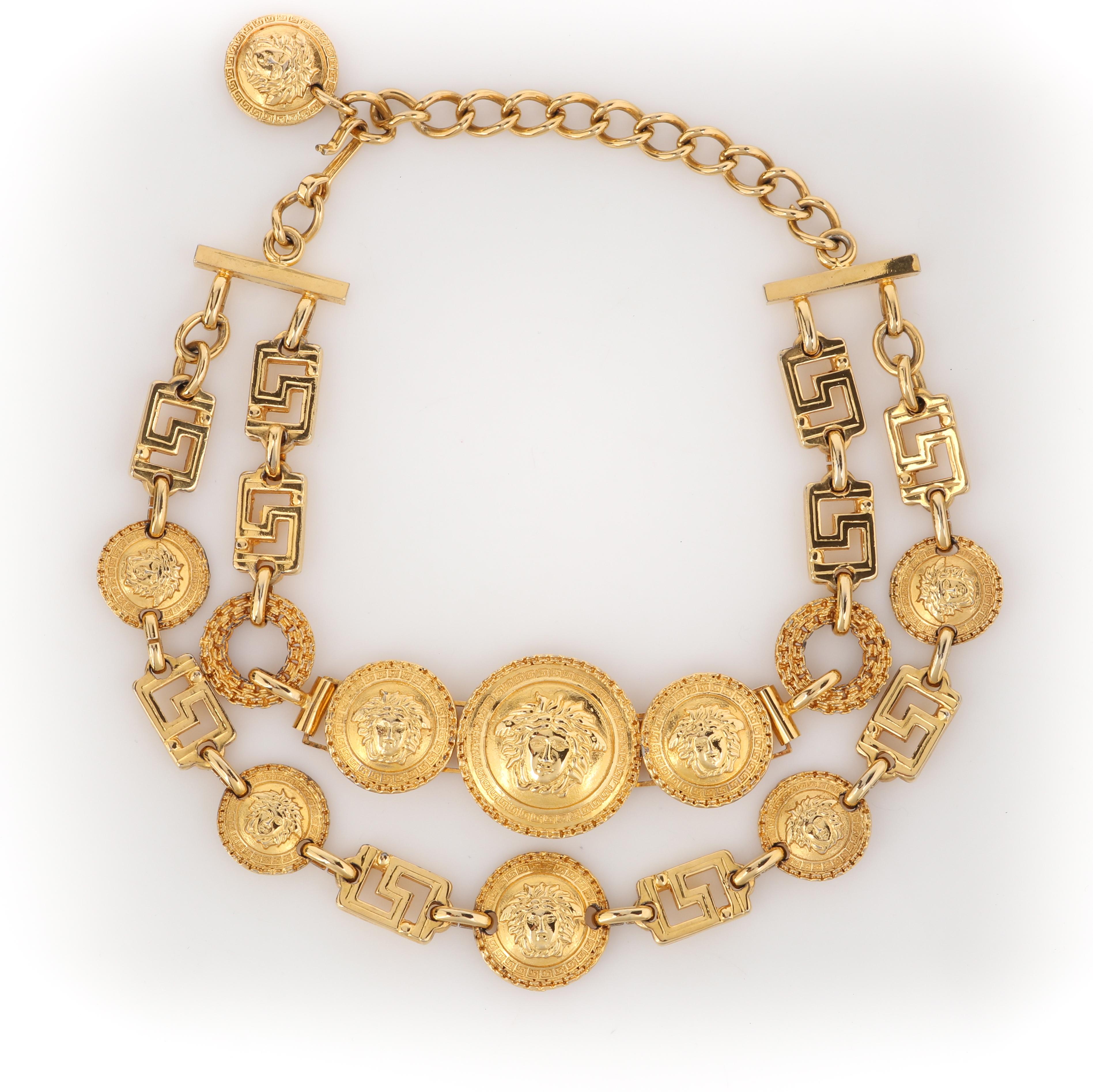 GIANNI VERSACE F/W 1992 Gold Signature Medusa Medallion Coin Choker Bib Necklace
 
Brand / Manufacturer: Gianni Versace
Collection: F/W 1992
Designer: Gianni Versace
Style: Chain bib necklace
Color(s): Gold
Unmarked Material (feel of): Gold plated