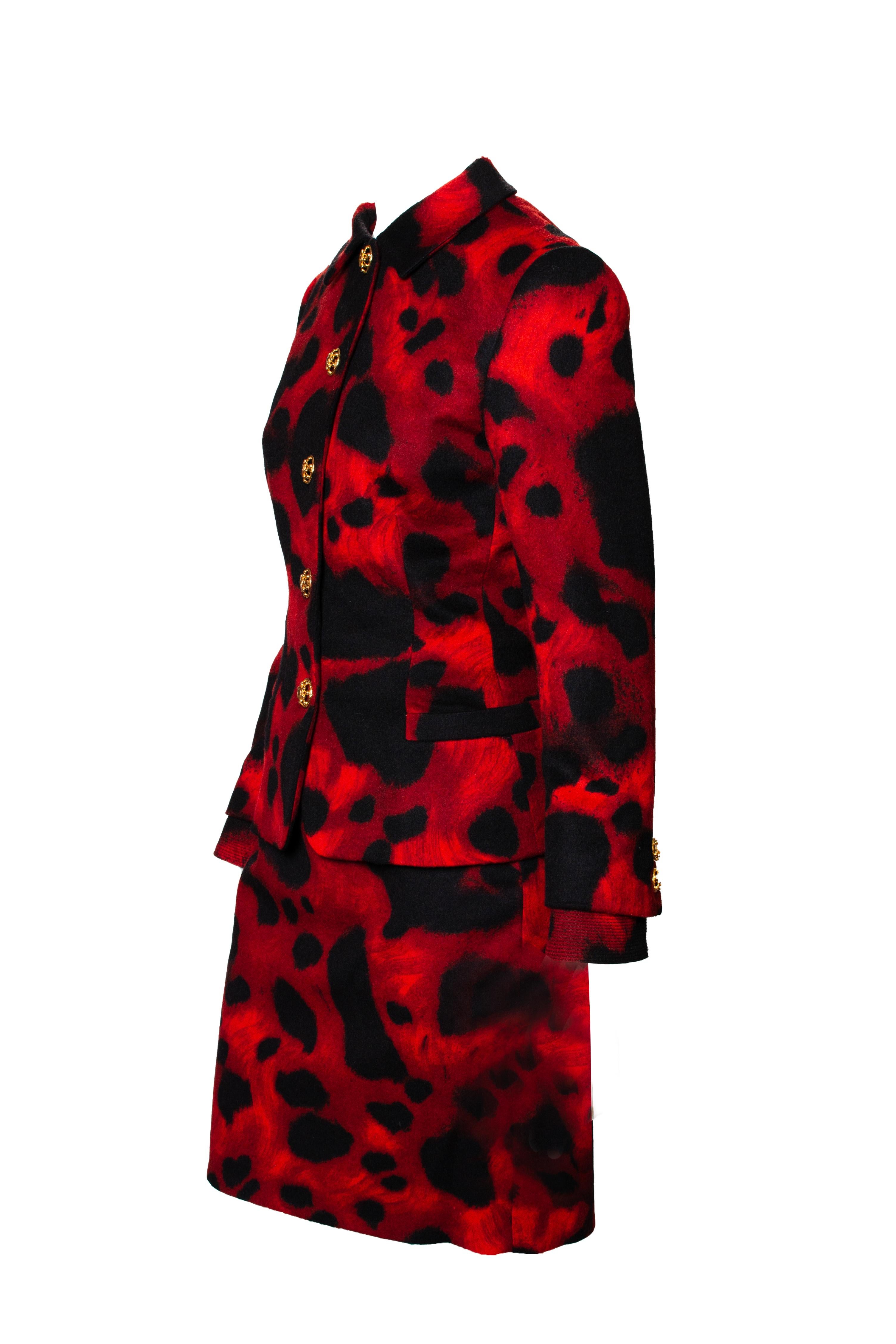 This classic red leopard print skirt suit is from Gianni Versace's Fall/Winter 1992 collection, designed by Gianni Versace. If this isn't a power suit, we are not sure we know what is. This set features a vibrant suit jacket with a matching skirt.