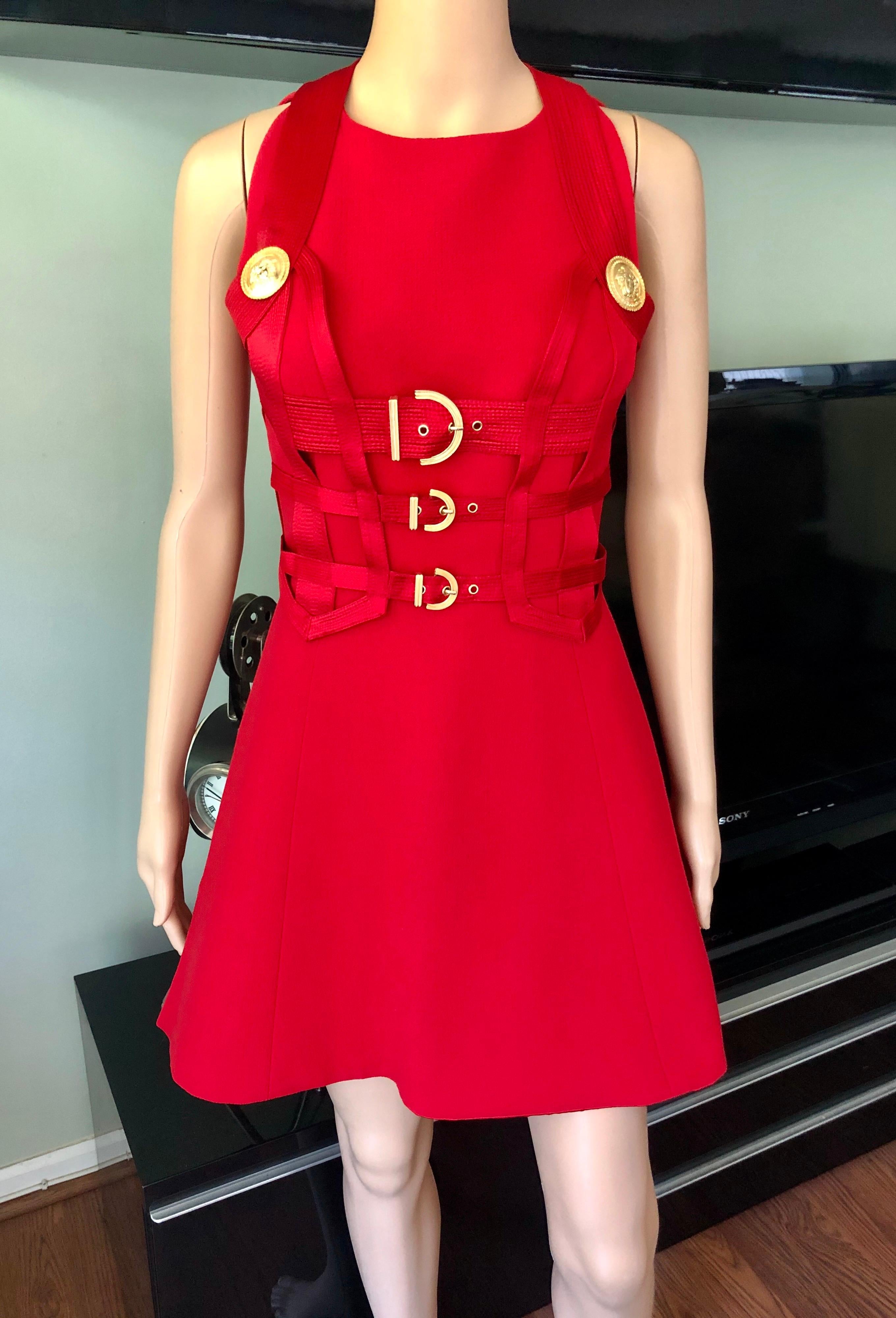 Gianni Versace F/W 1992 Runway Vintage Bondage Harness 2 Piece Red Dress IT 42

Gianni Versace Couture red dress featuring bondage harness bodice with gold-toned Medusa embossed hardware. Design featured on the unforgettable Fall/Winter 1992 