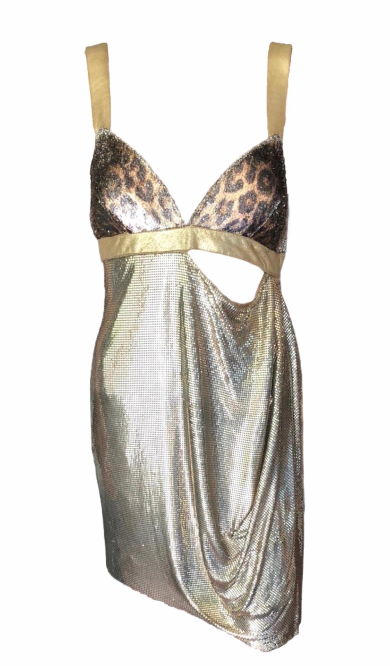 Gianni Versace F/W 1994 Runway Ad Campaign Vintage Gold Oroton Metal Mesh Dress 

COLLECTIBLE ITEM! Gold vintage Gianni Versace metal mesh oroton chainmail mini dress with textured leopard pattern at bust, cutout at waist, draped skirt panel and