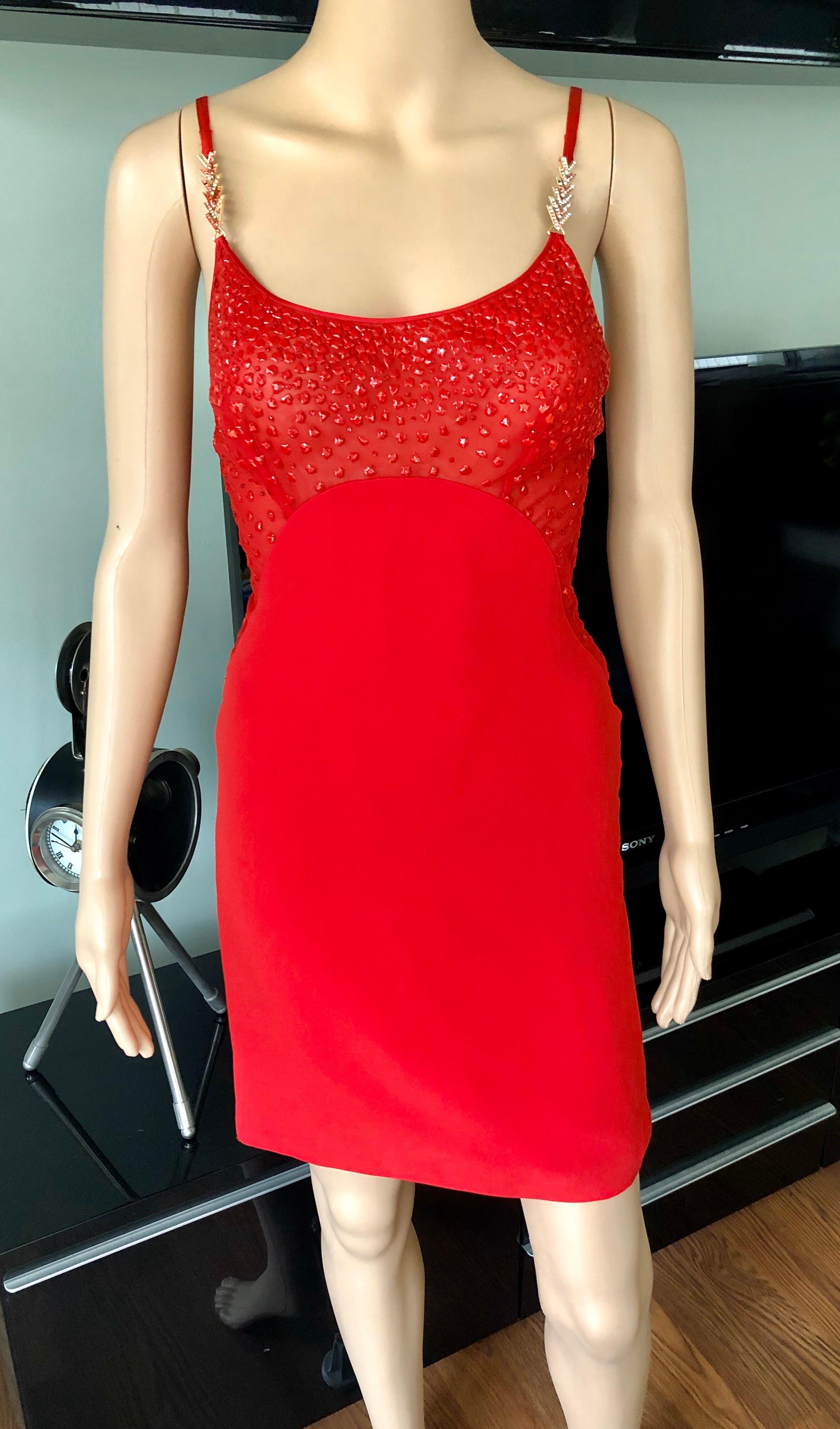 Gianni Versace F/W 1996 Runway Vintage Embellished Sheer Red Evening Mini Dress IT 38

Gianni Versace couture evening dress featuring sheer top, embellished straps, square neck and concealed zip closure at side. 

Good condition - minor missing