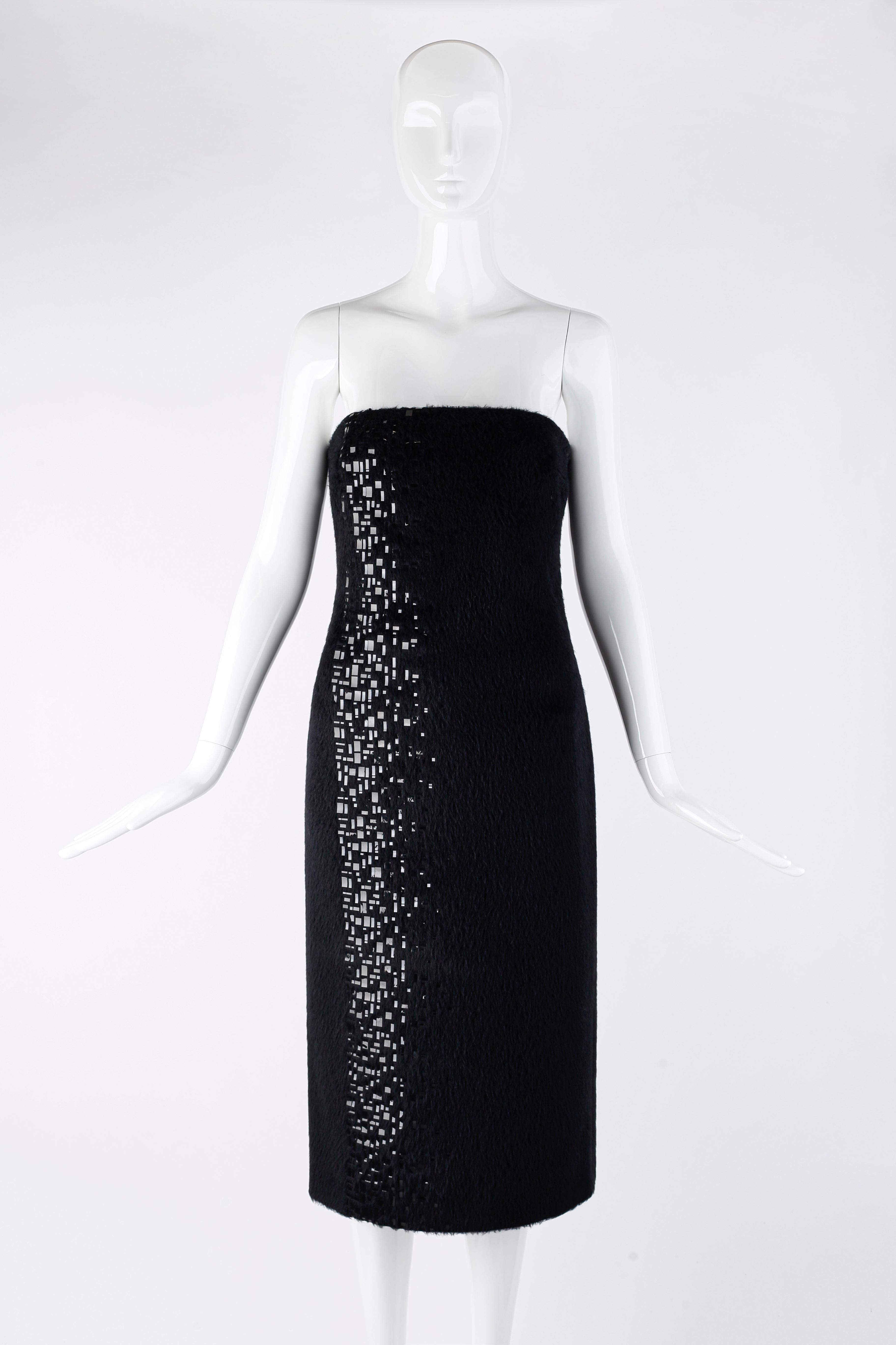 Designed by Donatella Versace for the fall/winter 1998 runway collection. Black alpaca wool blend fabric. Beautiful asymmetric plastic sequin embellishments in various shapes and sizes designed vertically along the right side only. The