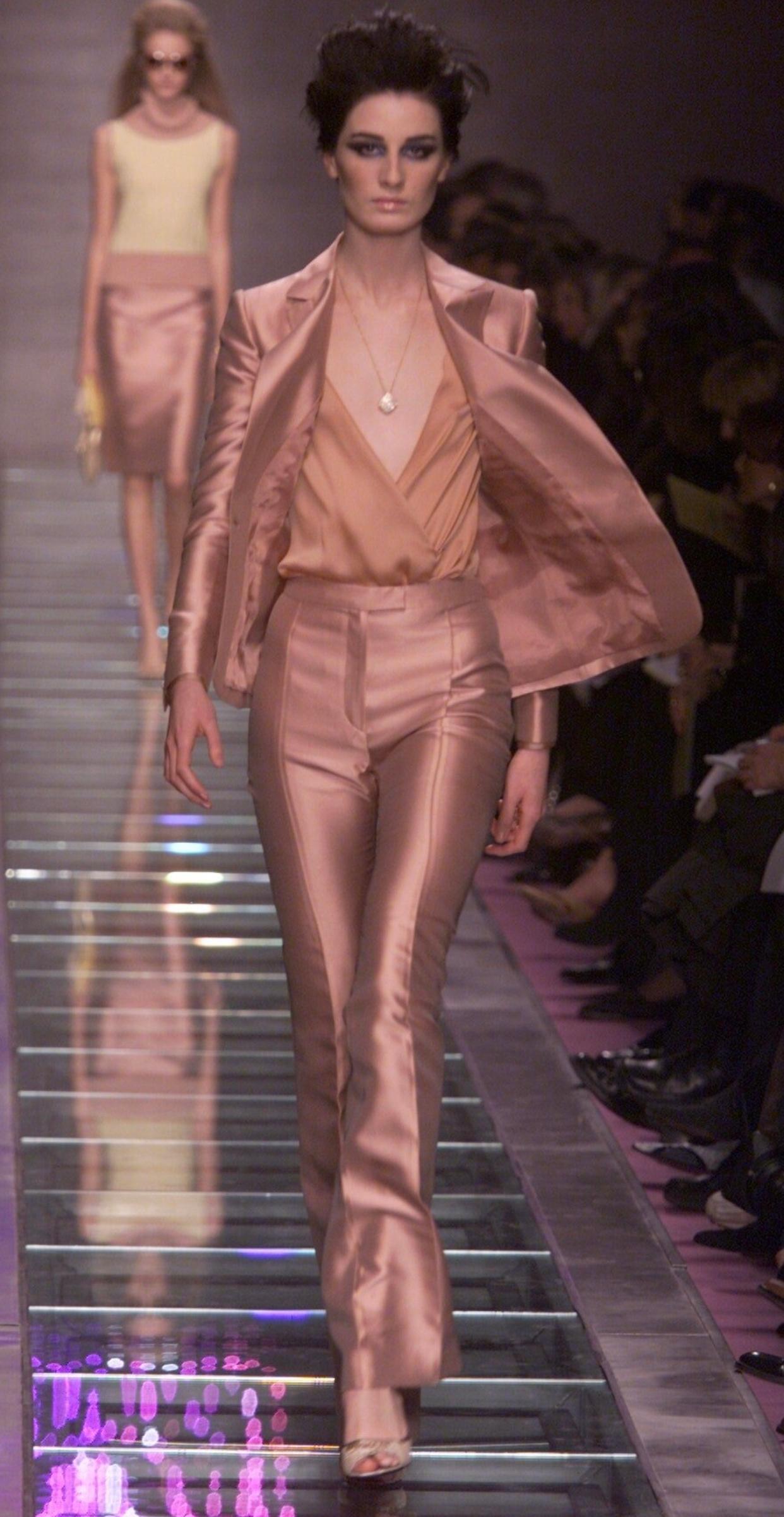 Introducing the Gianni Versace Silk Shimmer Gold Pink Suit from the Fall/Winter 2000 runway. This opulent ensemble features Medusa buttons and a flawless tailored fit, exuding timeless elegance and luxury. Embrace Versace's fearless style and make a
