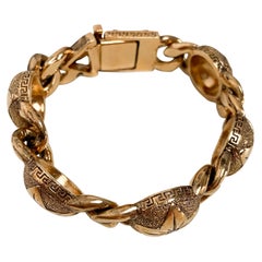 Bracelet cercle et étoile en or de Gianni Versace