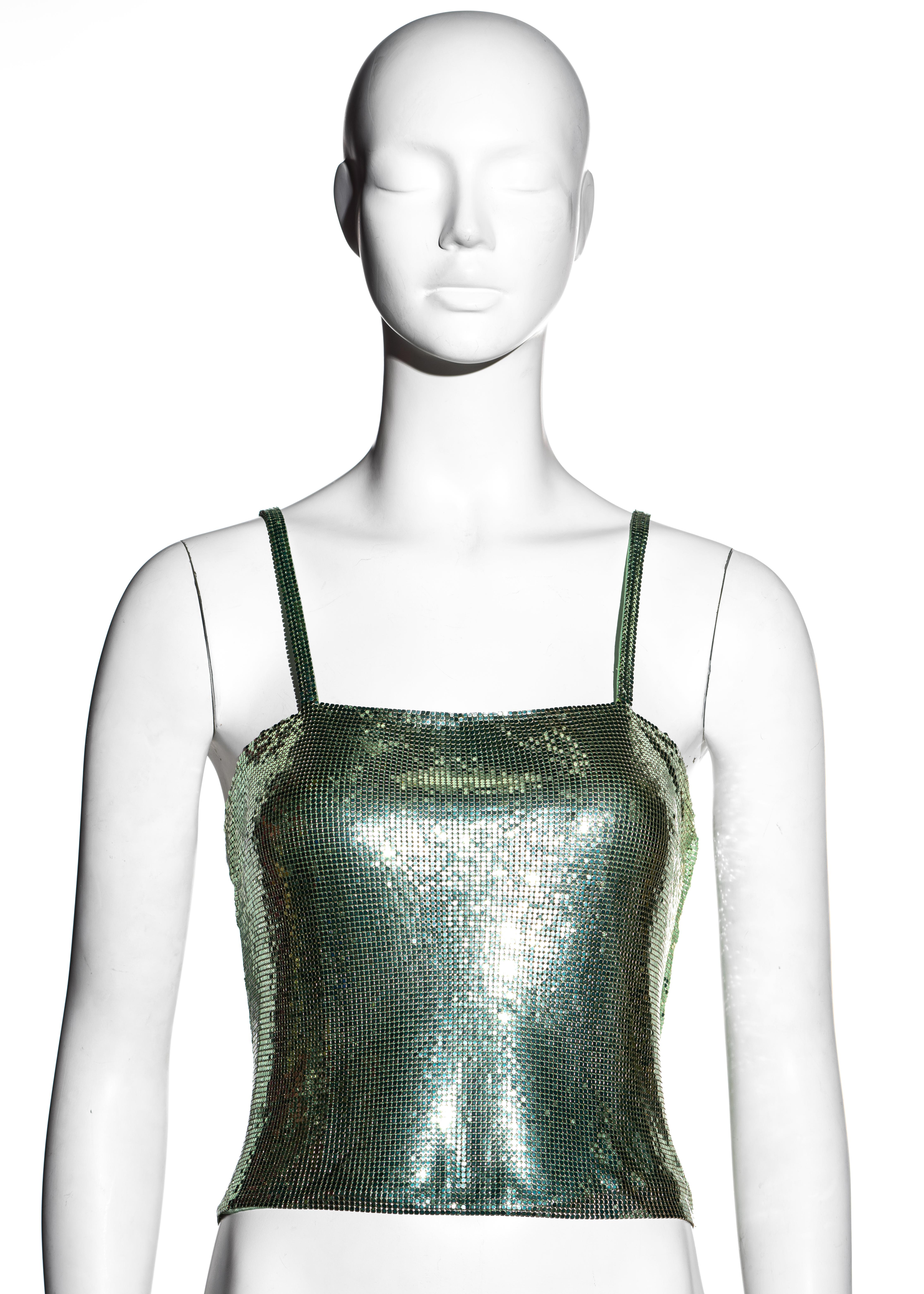 ▪ Gianni Versace green Oroton metal chainmail evening vest
▪ 100% Aluminium, 100% Silk
▪ Spaghetti straps 
▪ Zip fastening at side seam
▪ IT 40 - FR 36 - UK 8 - US 4
▪ Spring-Summer 2003