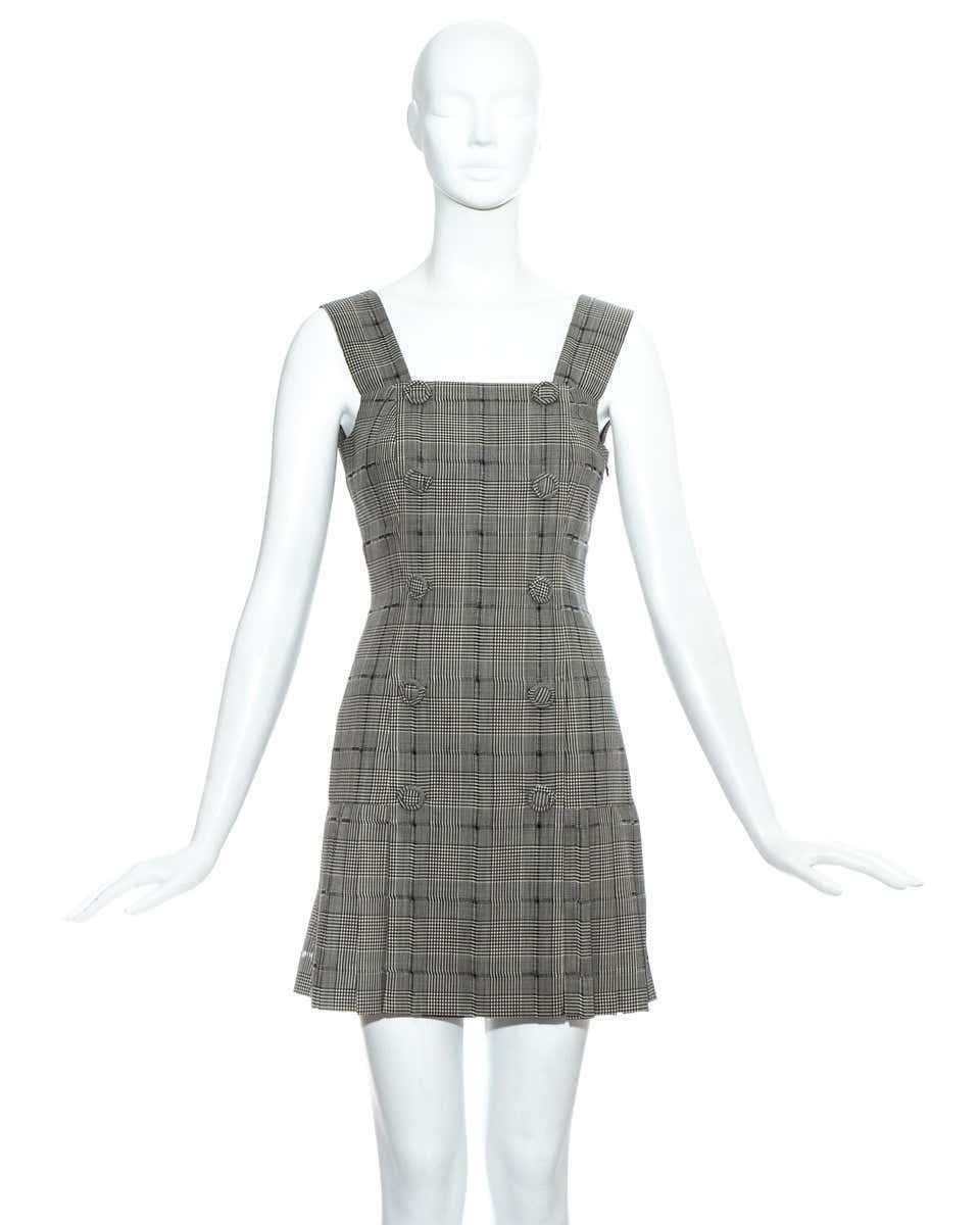 Gianni Versace grey checked wool pinafore dress with box pleated skirt and 10 fabric buttons. 

Spring-Summer 1994
