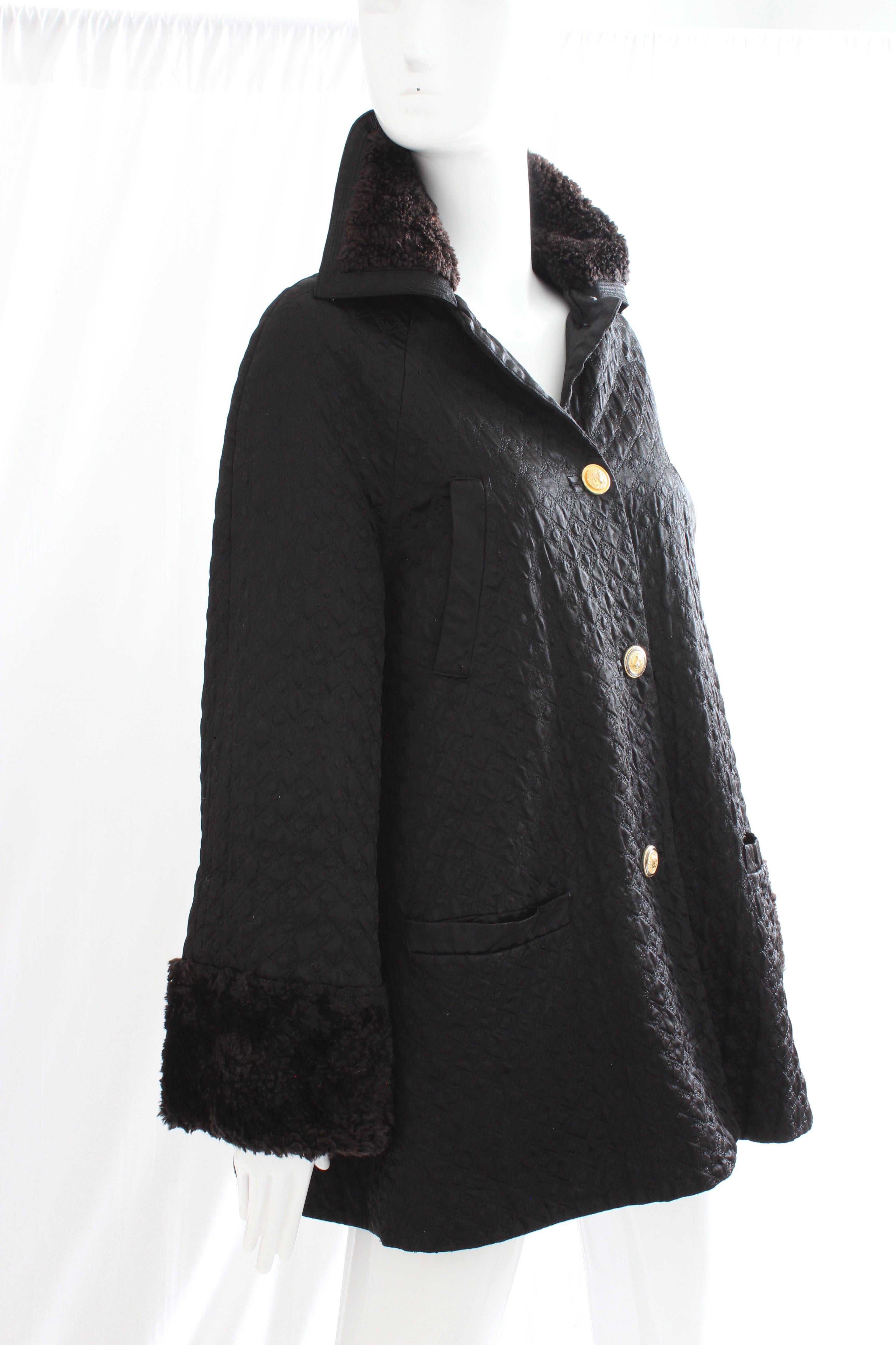 This black diamond-quilted satin jacket with fur trim was made by Gianni Versace for their Versus label, most likely in the 1990s.  No content label, but this piece appears to be made from a soft synthetic black satin and has deep brown faux fur