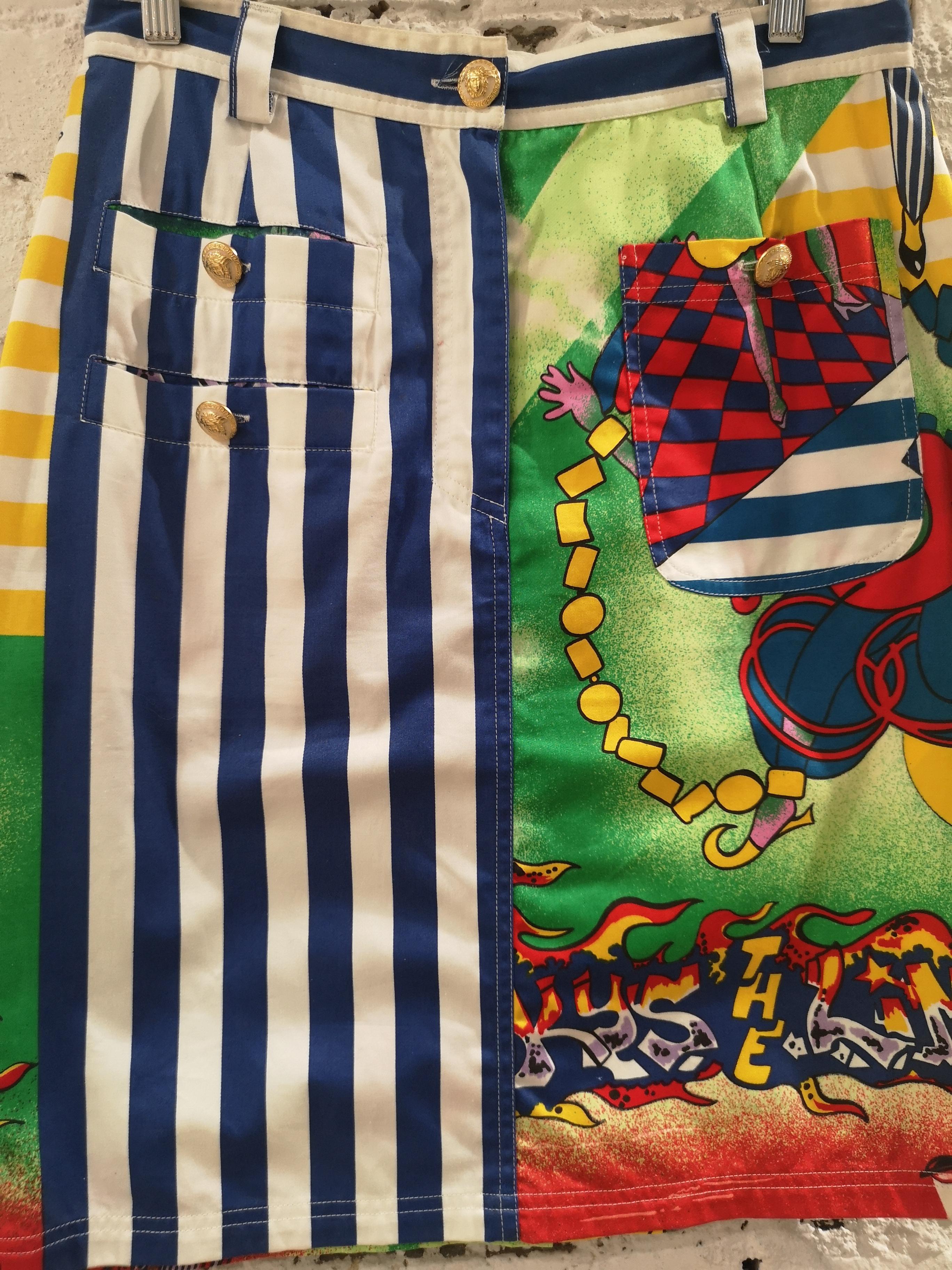 Gianni Versace jazz cotton skirt 
Versace Jazz skirt, blue white stripes and multicoloured cotton skirt totally made in italy in size 46 
embellished with logo buttons
measurements:
waist 76 cm
lenght 57 cm