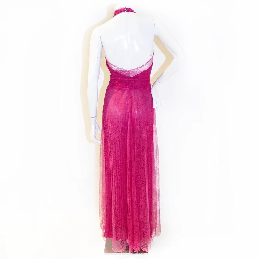 Gianni Versace by Donatella Versace Gown 
Fall / Winter 2000 
Made in Italy 
Hot Pink 
Plunging halter neckline 
Interior of bust line has built in bra 
Invisible zipper down front of dress starting at bust 
Snap closures at bust 
Four pink crystal