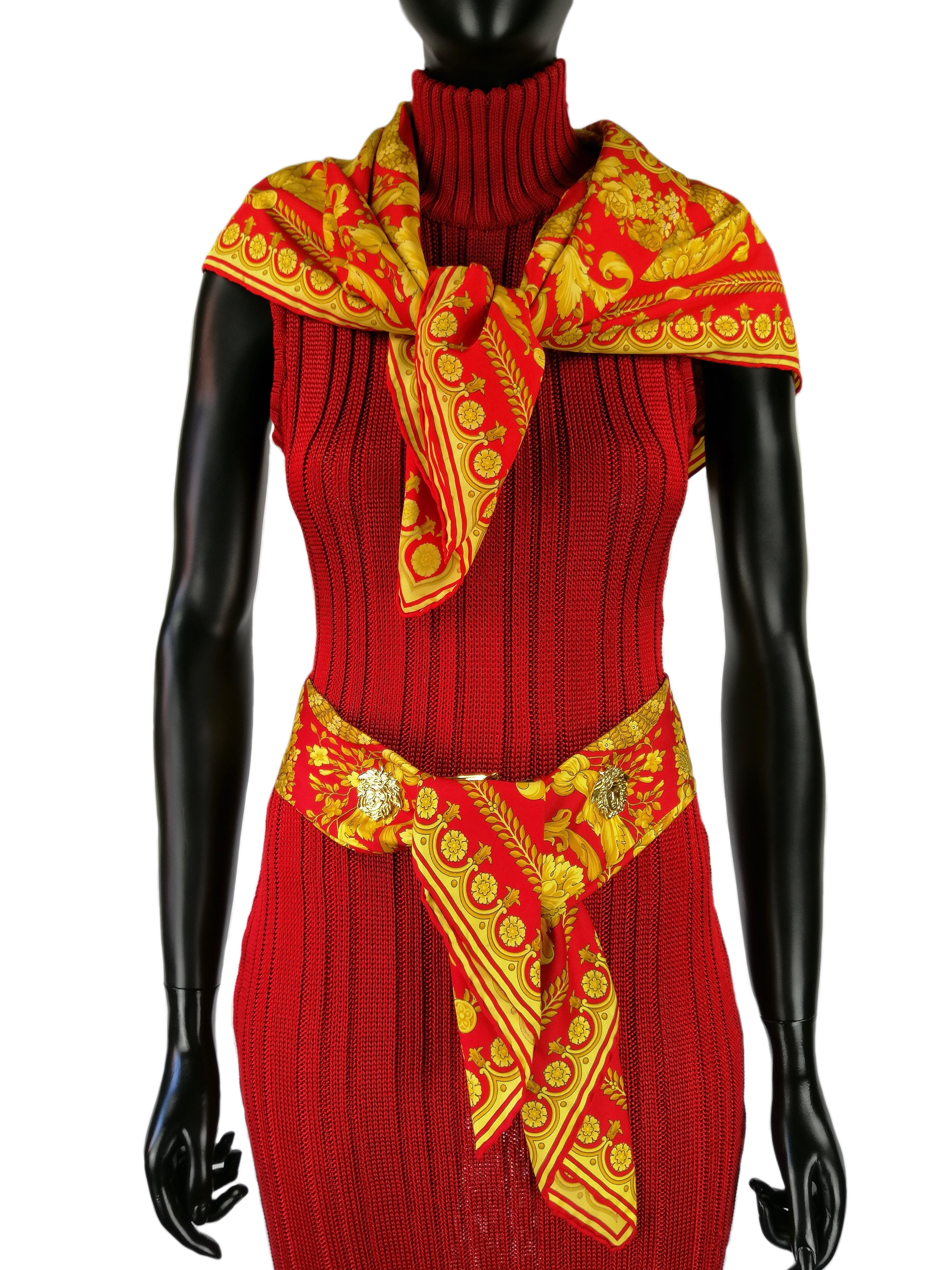 GIANNI VERSACE
Long red ruby knitted dress
Fall/Winter 1993
High neck, sleeveless 
Vertical perforated weave back
100%  acetate
Made in Italy
Size IT 40 / S
Very good condition
Small mending on the left front in the lower part, as in the photo n.