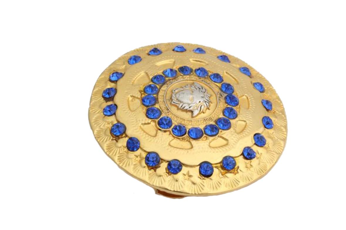 Gianni Versace gold Medusa hair pin with blue rhinestones.


