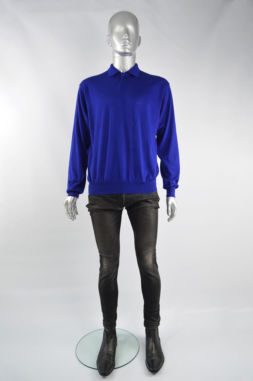 A stylish vintage Gianni Versace mens sweater from the 90s for the 'Couture' line. In a royal blue cashmere, silk and wool knit fabric with a polo shirt style collar and a Medusa logo button at the neck. 

Size: Marked IV / IT 50 which is roughly a