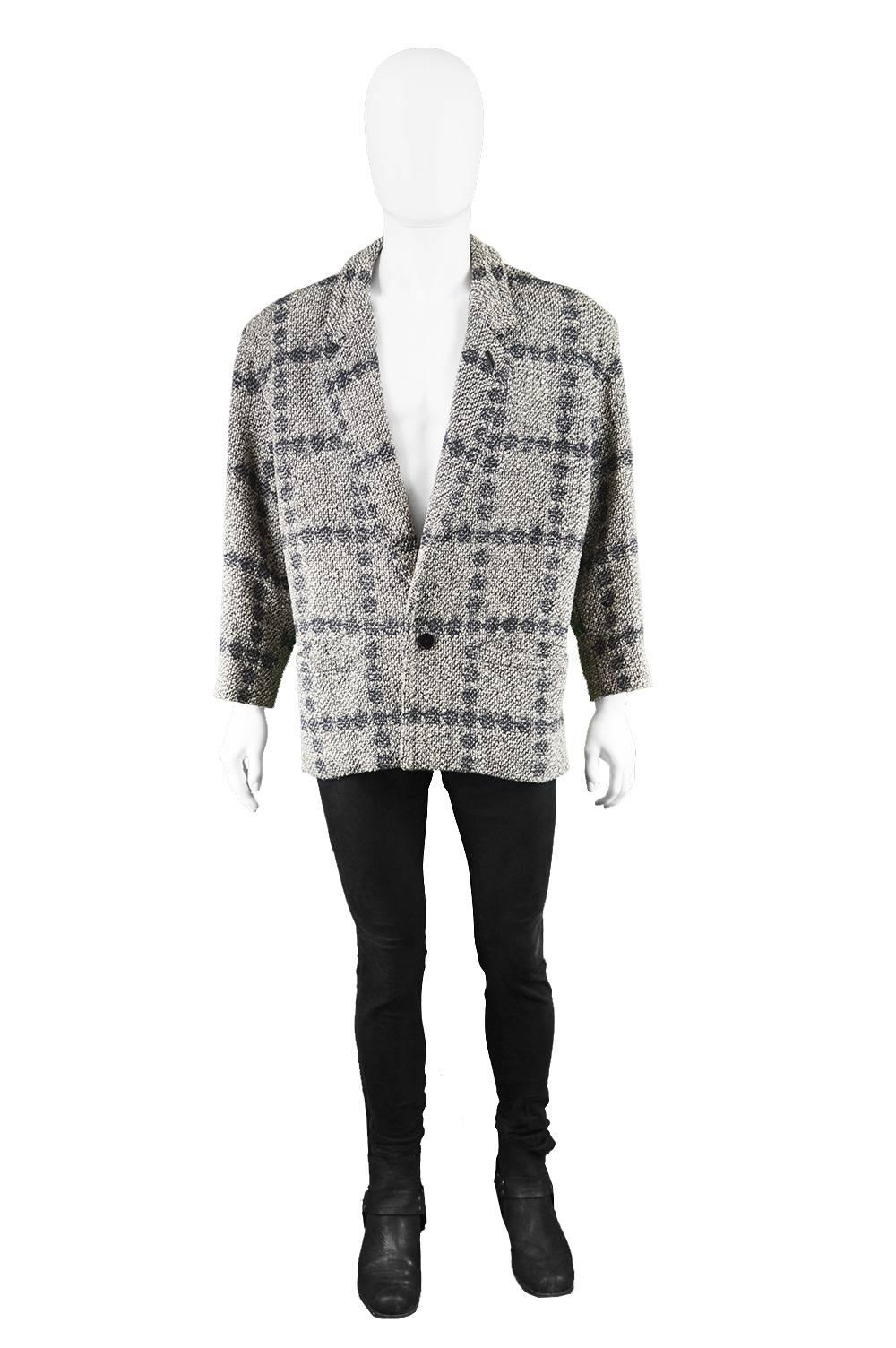 Gianni Versace Men's Vintage 80s Bold Shouldered Wool Tweed Blazer

Size: Marked 48 / Medium which gives a boxy, loose fit on the chest with a more tapered waist. 
Chest - 46” / 117cm 
Waist - 40” / 101cm
Length (Shoulder to Hem) - 27” /