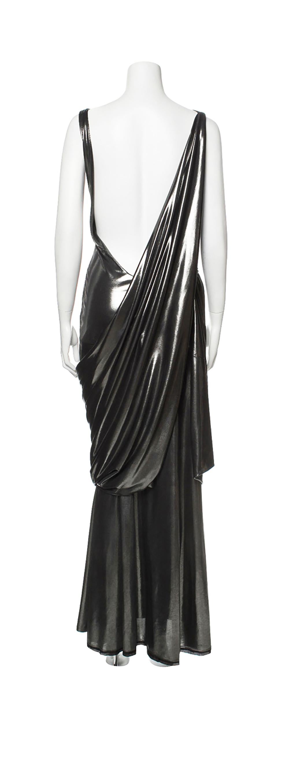 Late 1980s - early 1990s Gianni Versace Metallic Grecian Evening Gown by Gianni Versace
Sleeveless gown with cowl neck
stretch fabric
low back
condition: very good
size S
measurements taken un-stretched : Bust: 31