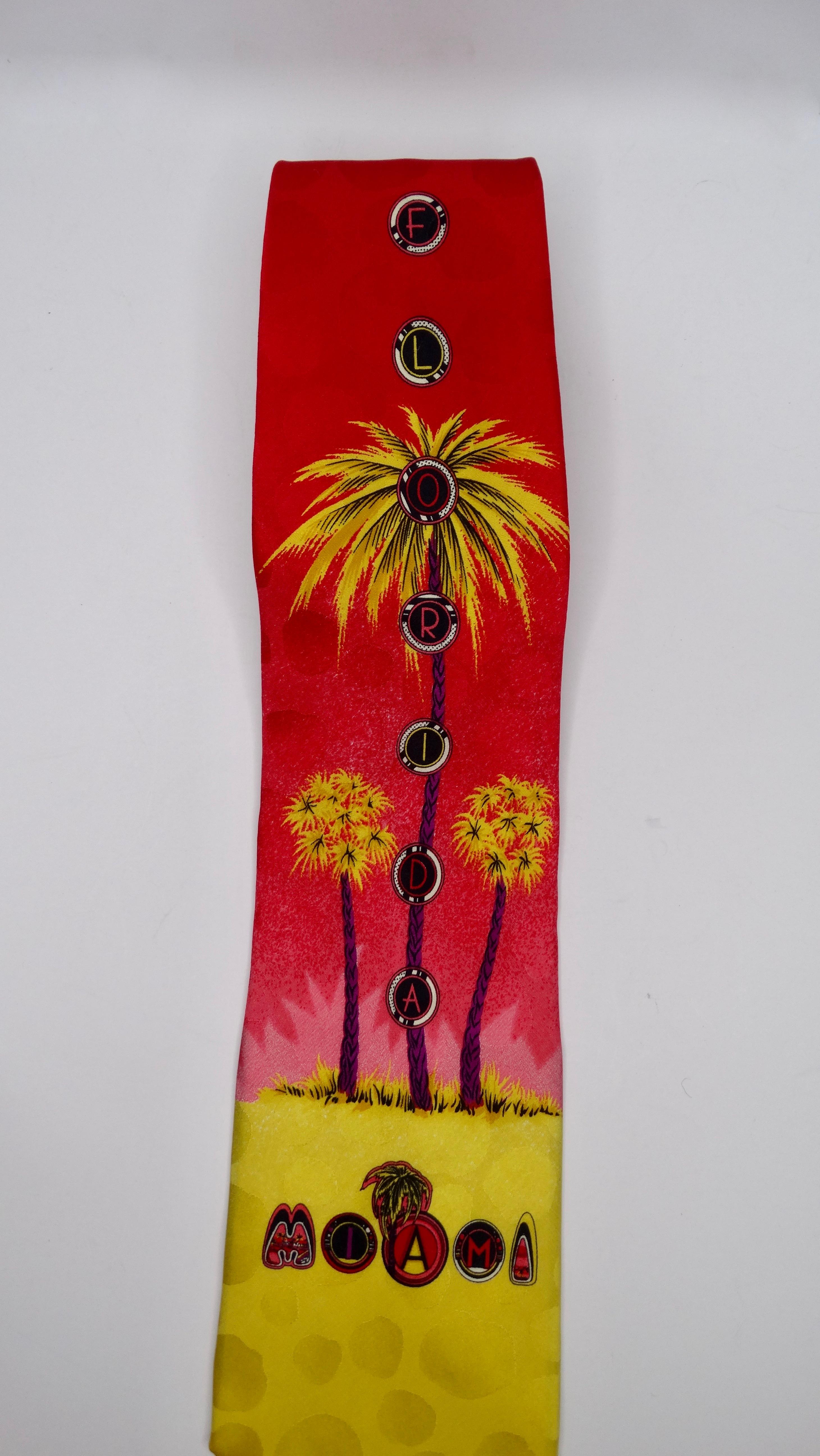 Gianna Versace straight from the archives! Circa 1990s, this silk tie features a Miami inspired print with bright ombre neon colors, polka dots, neon palm trees, and decorative fonts spelling out 