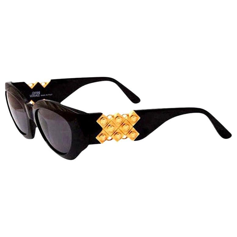 Gianni versace Sunglasses Mod 420/D with gold medusas on the side.