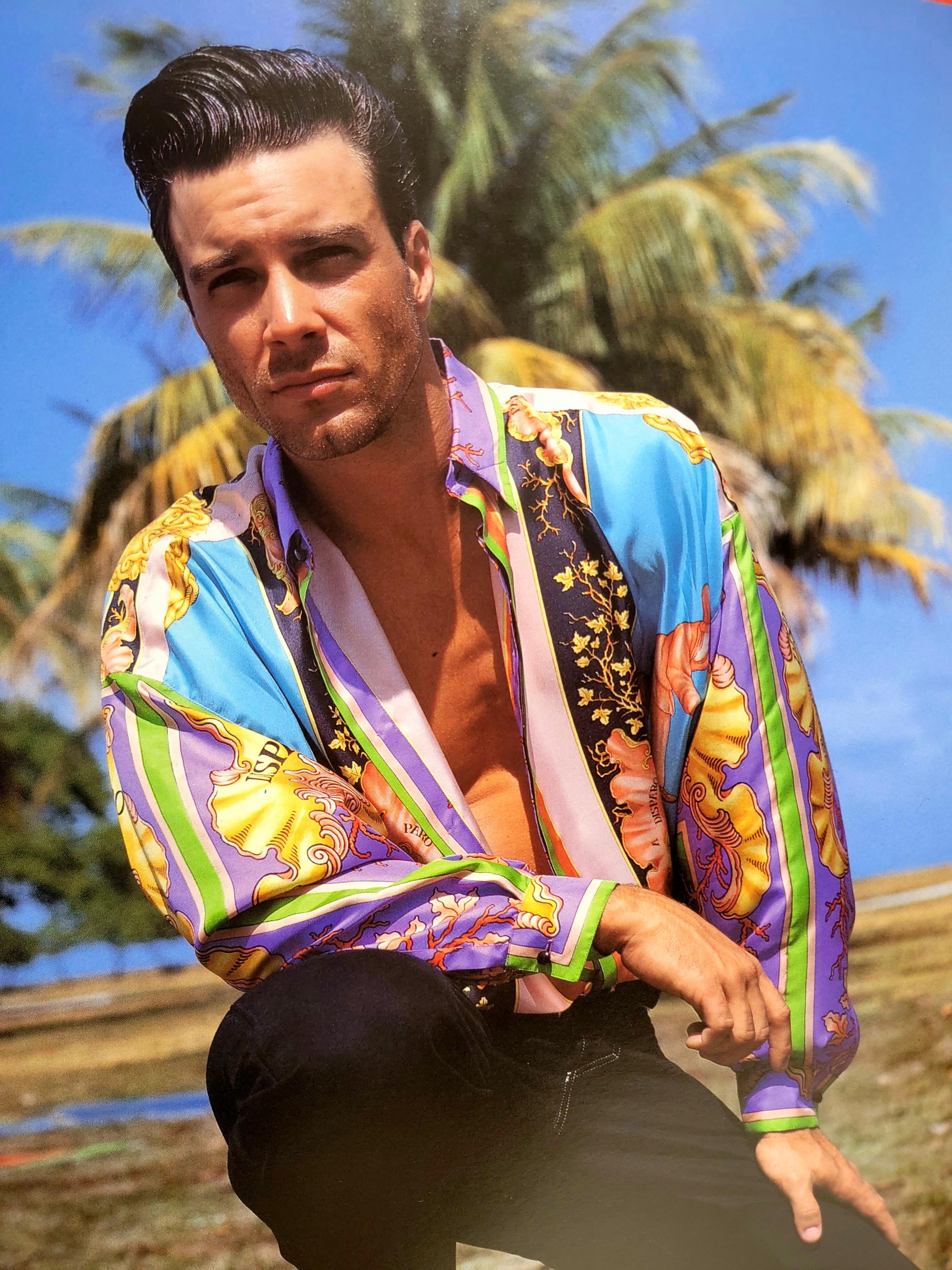 Gianni Versace Silk Men's Shirt from SS 1993.

This shirt has the “Naples“ print which shows a renaissance festival from the “Return of the feast of the Madonna of the Arc” painting.

This print shirt was shown in the 1993 South Beach Stories Miami