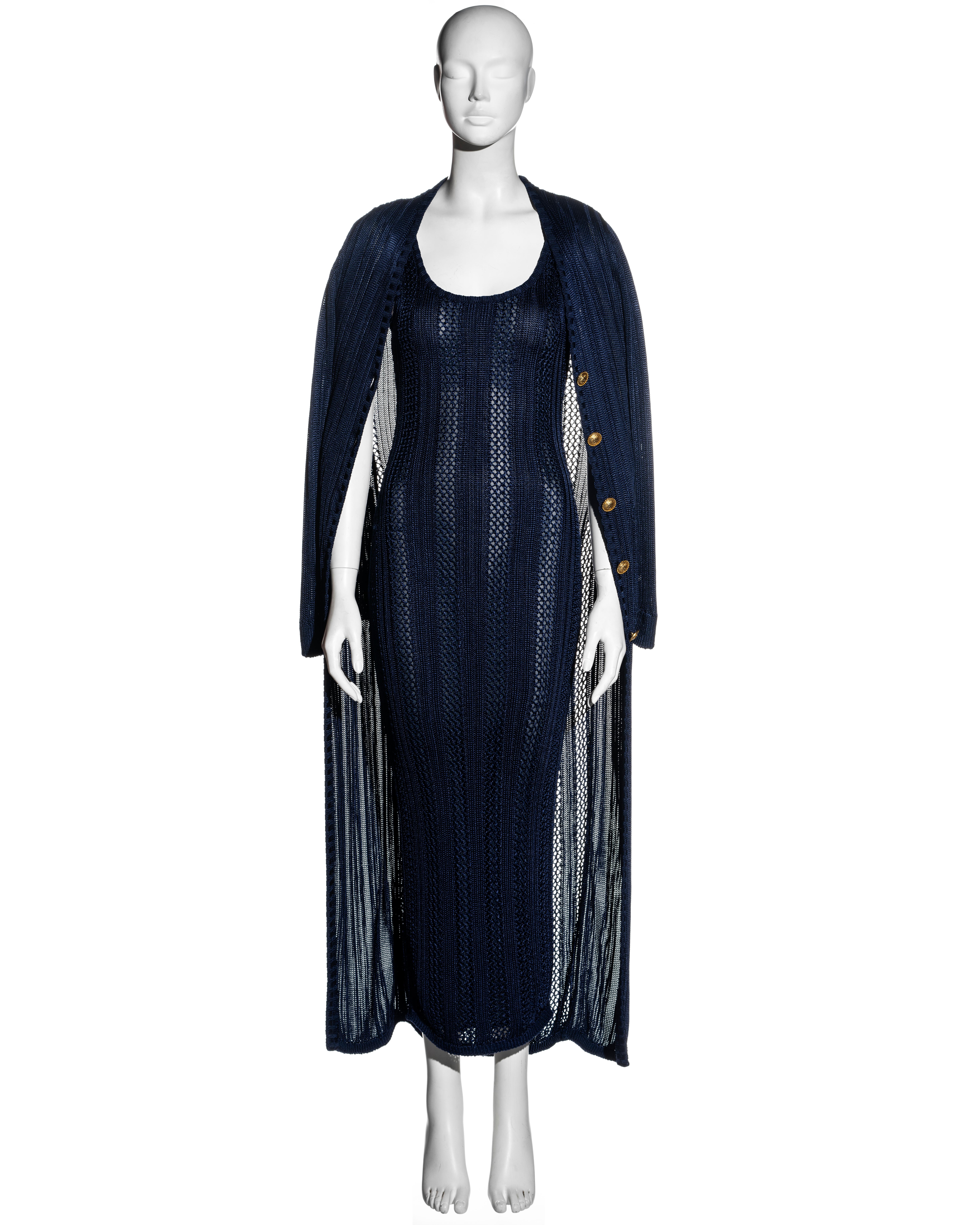 ▪ Gianni Versace navy blue open-knit dress and cardigan 2 piece set
▪ Sleeveless bodycon maxi dress with lining
▪ Long-sleeve full-length cardigan 
▪ Gold Medusa buttons 
▪ Can be worn together or separately 
▪ IT 40 - FR 36 - UK 8
▪ 100% Acetate 
▪