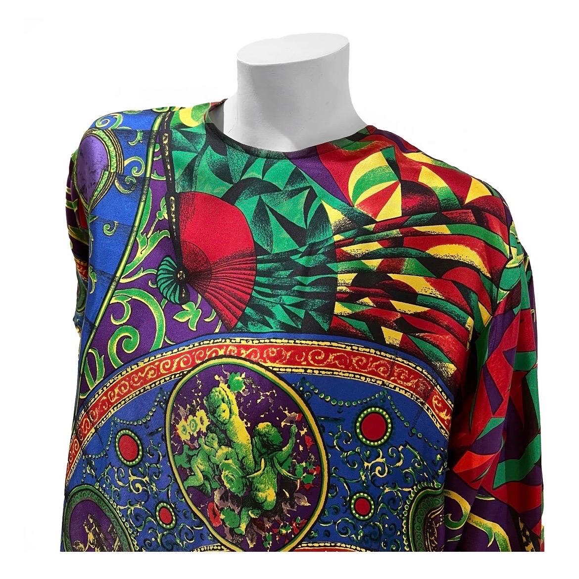 Vintage fan print silk blouse by Gianni Versace
Circa 1990's 
Made in Italy
Multicolored fan print with cherub illustrations and baroque print
Double button at back collar
Single button closure on each wrist cuff
100% silk
Condition: