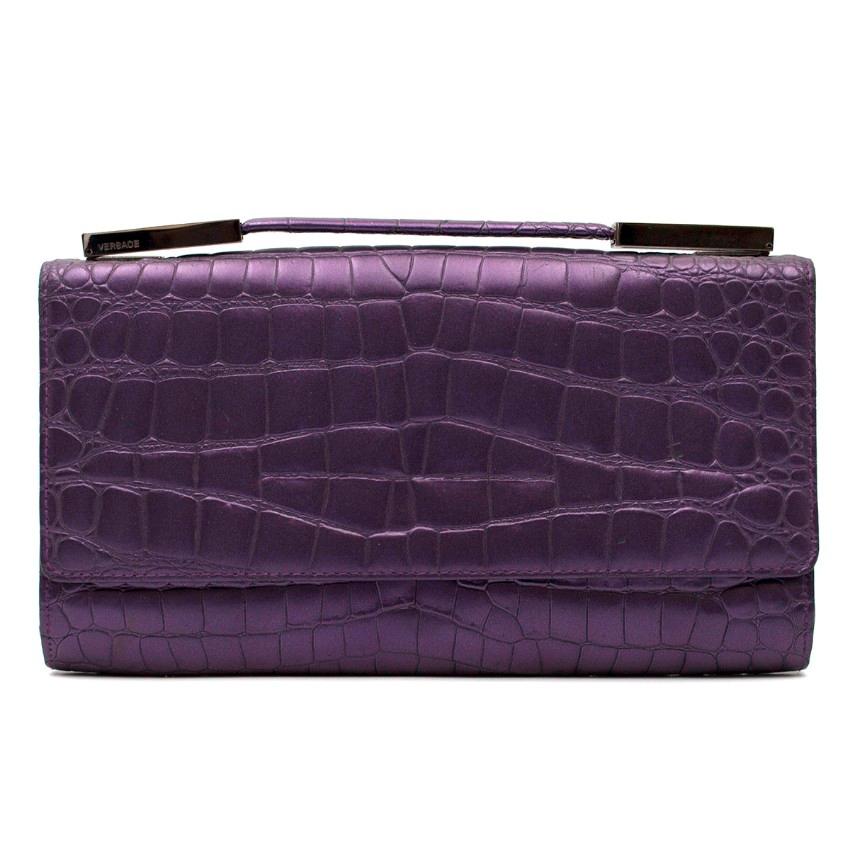 Gianni Versace Purple Croc Embossed Clutch

-Purple clutch with croc embossed leather
-Silver tone hardware
-Flap with popper closure
-One main interior pocket with one slot and one further zipped pocket

Please note, these items are pre-owned and