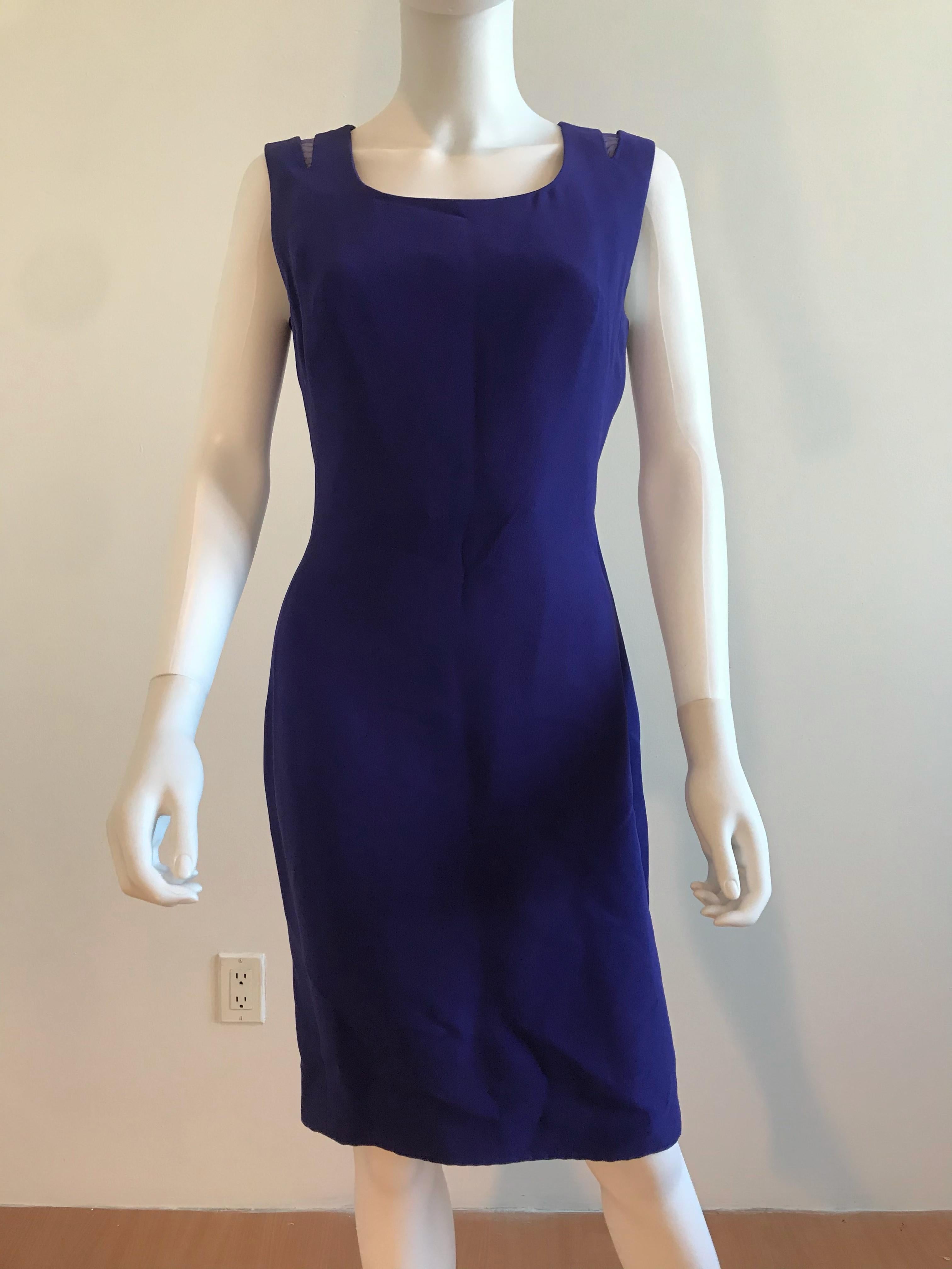 A luxe vintage Gianni Versace Couture purple dress. This sleeveless showstopper has a scoop neckline and purple mesh insets in place of the shoulder cutouts. The dress is fully lined in silk, has inner boning corset, and has a zipper enclosure in