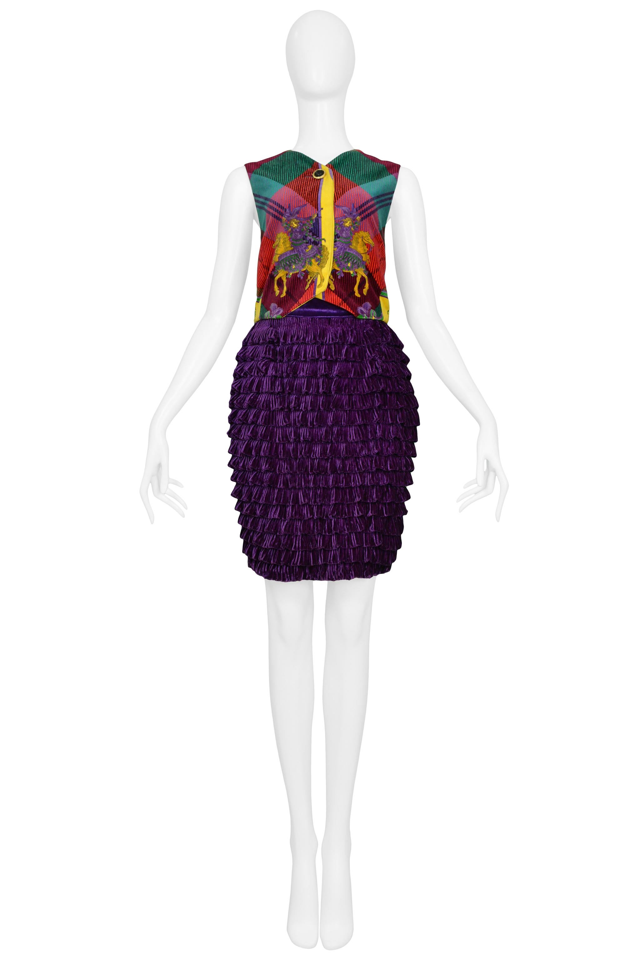 Resurrection Vintage is excited to offer a vintage Versace velvet vest and skirt ensemble featuring a plaid jewel-tone vest with embroidered horses and a purple ruffle skirt. 

Versace 
Size 42
Measurements: Waist: 26 in. (66.04 cm)Hip: 36 in.