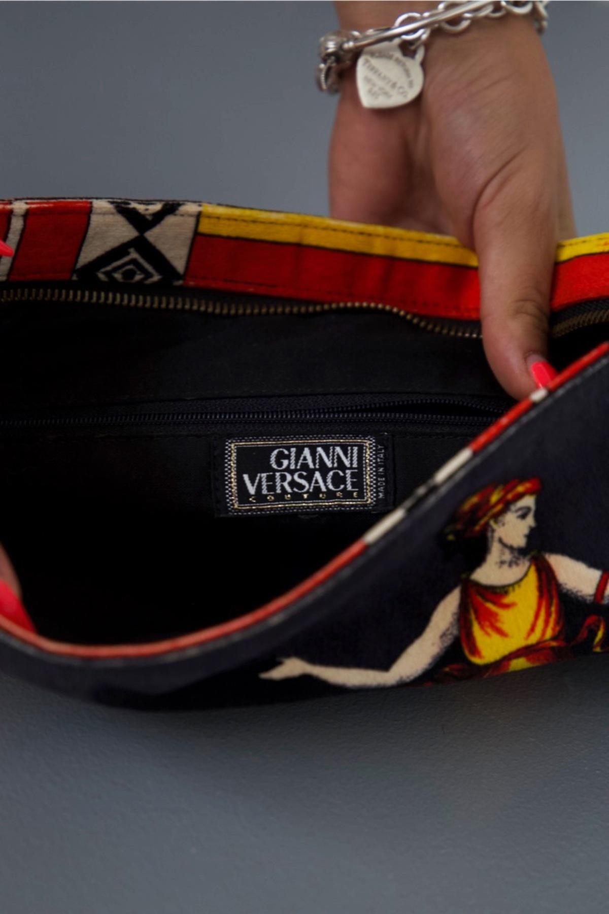 Rare vintage clutch bag designed by Gianni Versace in the 1990s, made in Italy. ORIGINAL LABEL.
The clutch bag is inspired by Greek architecture and art, which Versace translates into prints for his pantheon of fashion items. 
Made entirely of silk