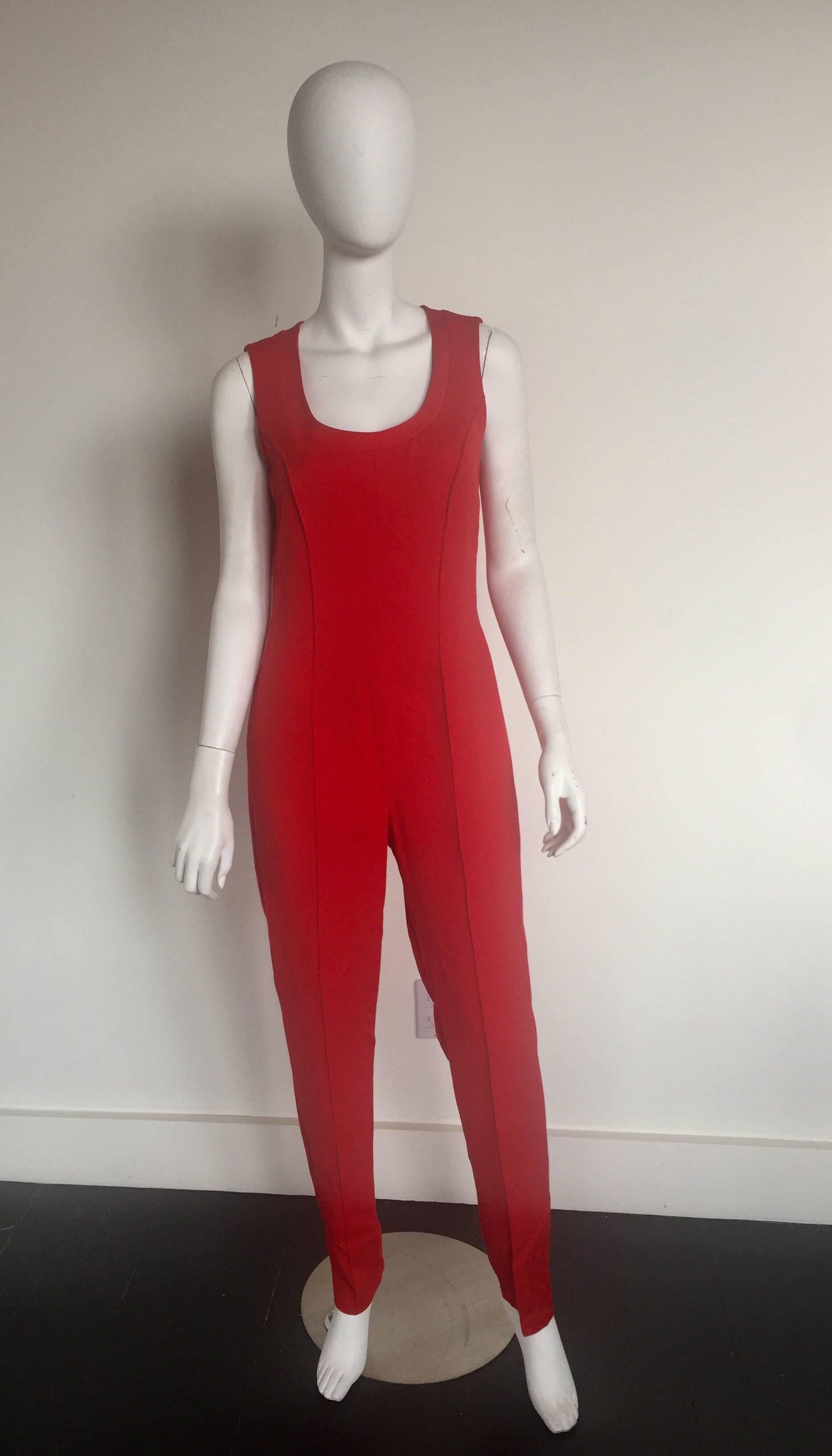 This iconic Gianni Versace Jumpsuit is a size X with a matching cropped bolero jacket.  It is missing a size label but most closely fits as US 8.  Please check measurments