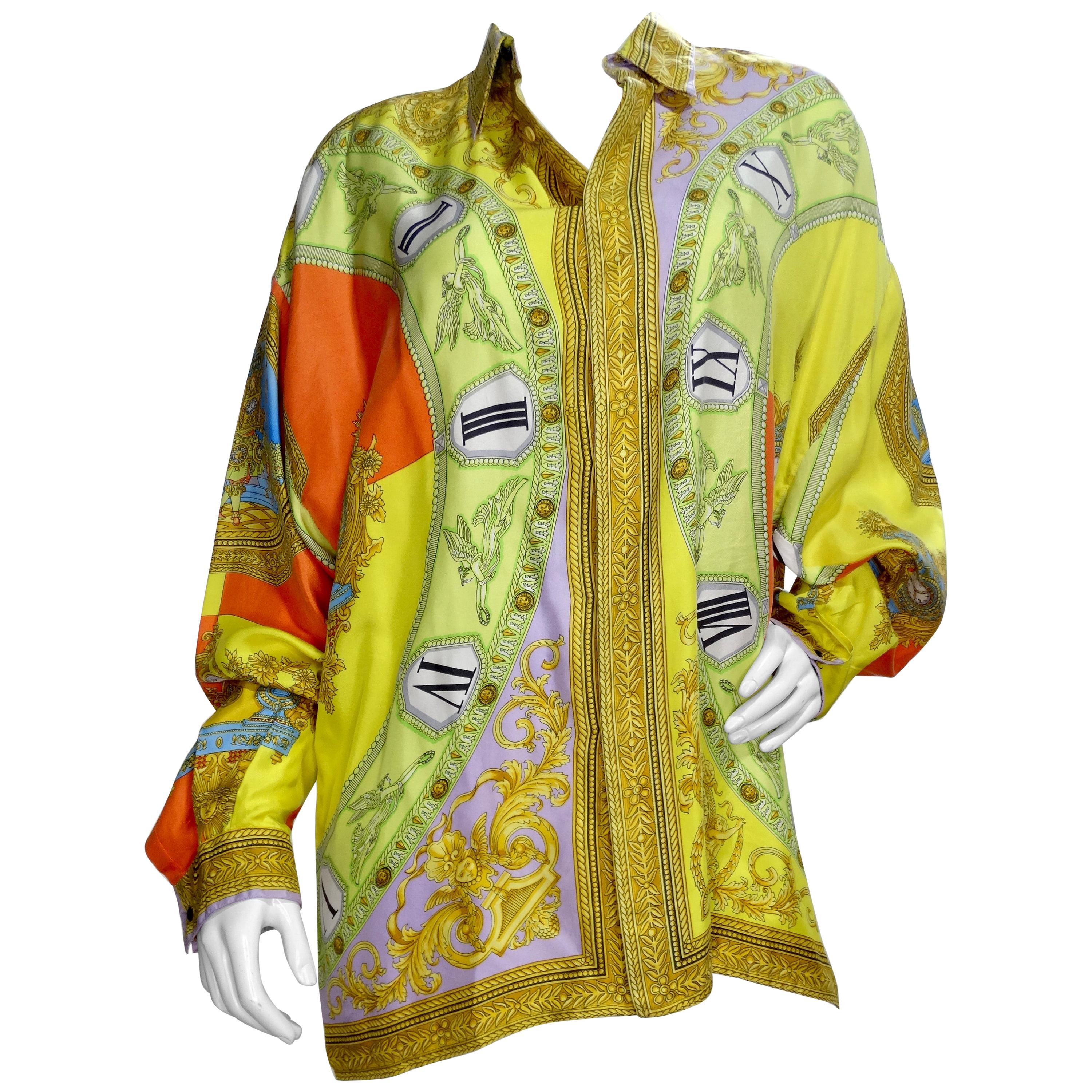 Snag yourself a piece from the Versace archives! Circa 1990s, this silk shirt features a colorful roman clock motif with images throughout of the Medusa medallion, Baroque designs and detailed portraits. Classic and timeless, this coveted piece will