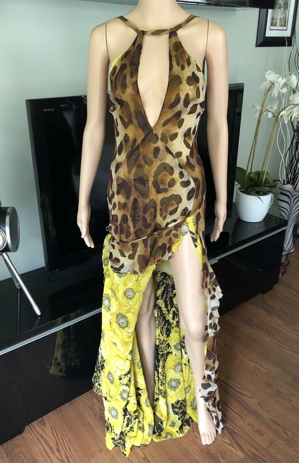 GIANNI VERSACE S/S 2002 Vintage Plunged Backless Dress Gown IT 42

Gianni Versace sleeveless maxi dress with leopard print throughout, plunging neckline, ruffled trim at skirt, high-slit at side, floral print at lining and concealed zip closure at