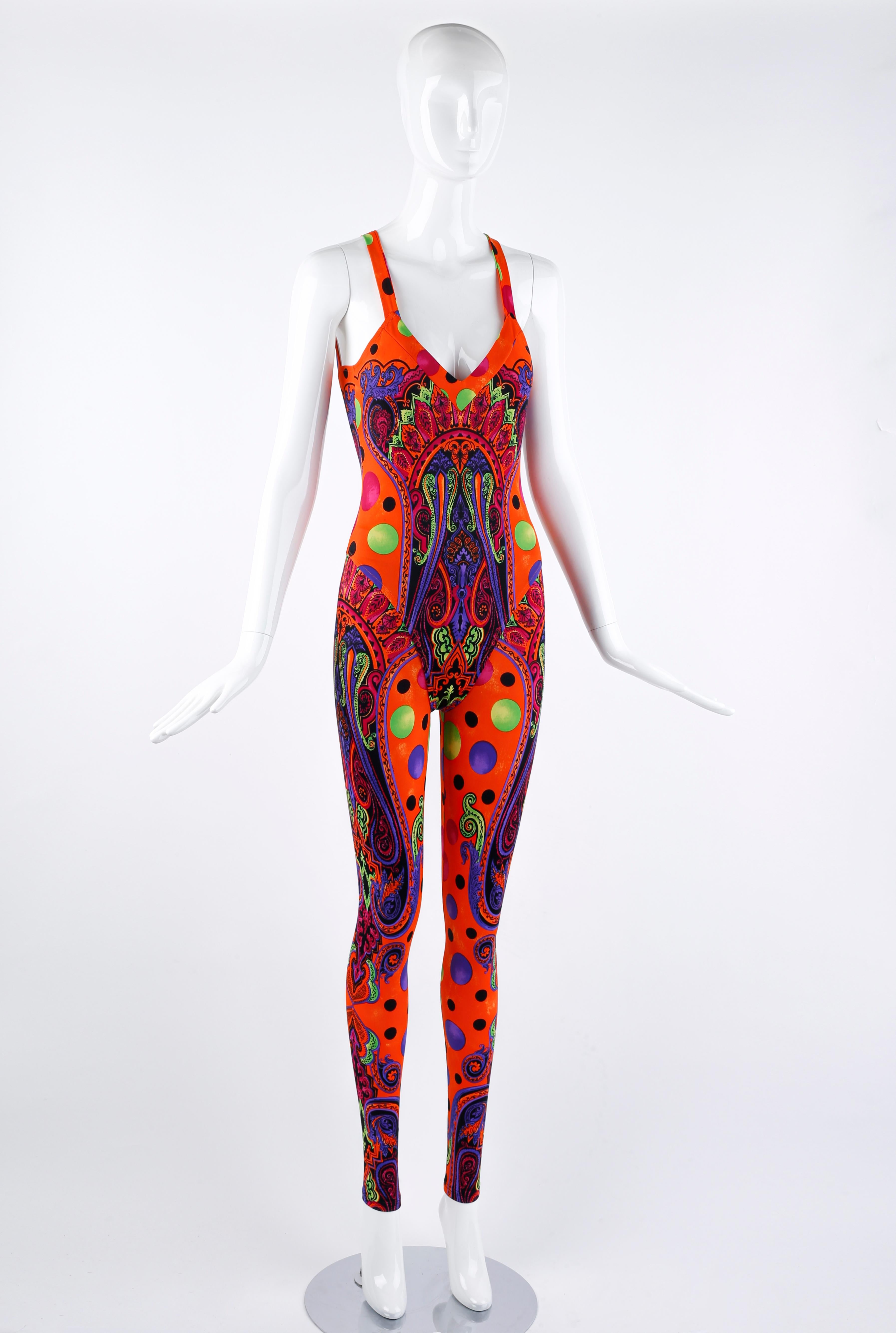 From Gianni Versace’s Spring/Summer 1991 “Pop Art” Collection, this rare set features the striking color palette and patterns the collection was famous for. This set features a combination of colorful dots of varying sizes combined with an intricate