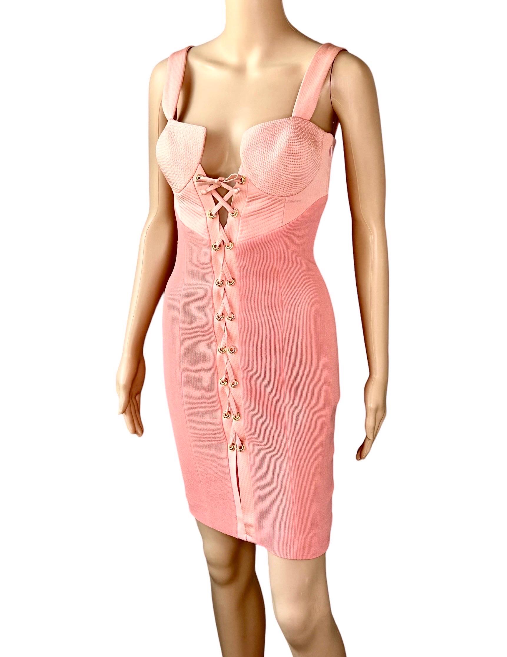 Gianni Versace S/S 1992 Couture Bustier Corset Lace Up Mini Dress IT 40

Condition: Good Vintage Condition. A couple missing embellishments on the grommets as is common with Gianni Versace pieces, not noticeable when worn.