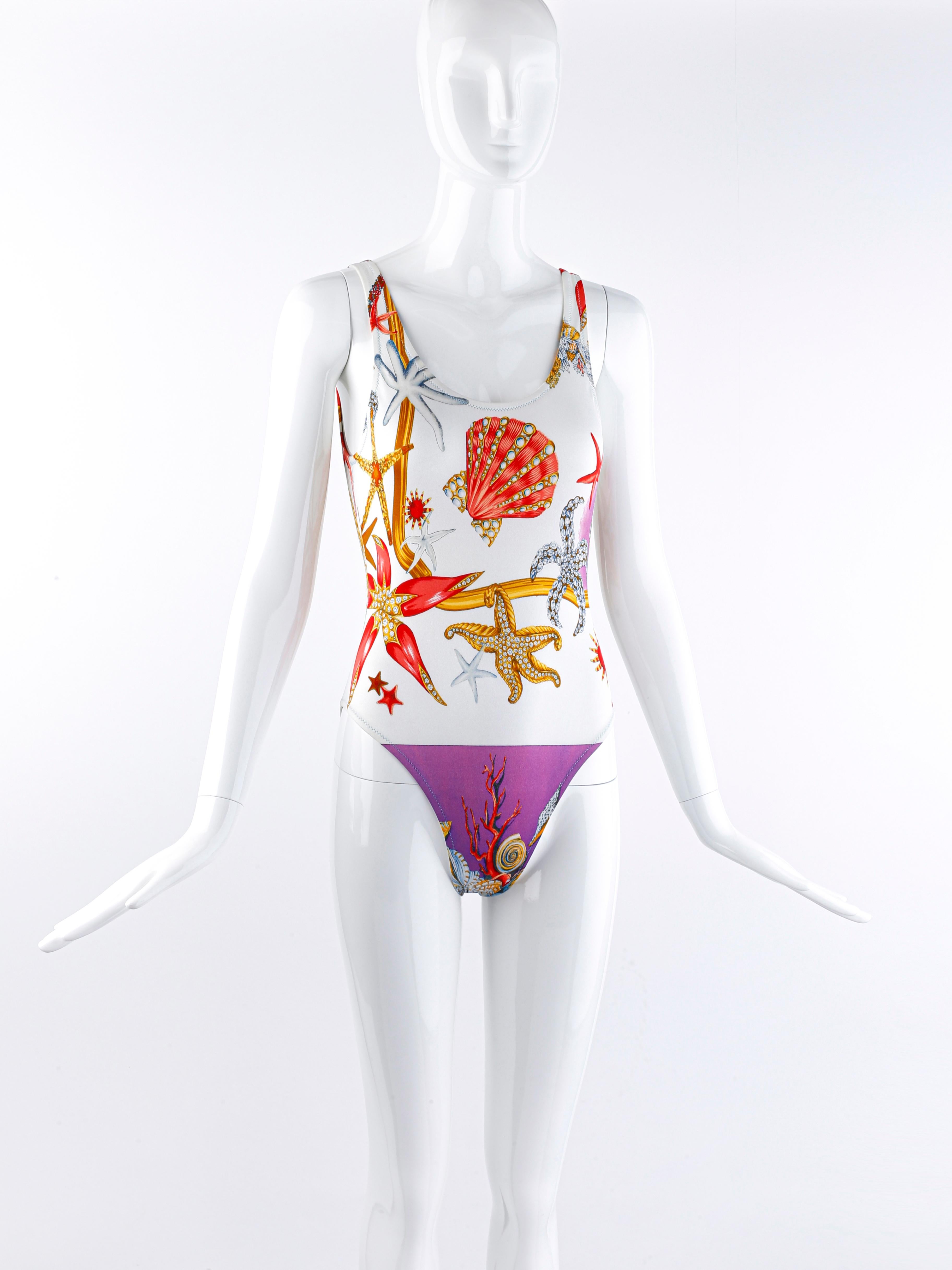 Vintage Versace Mare swimsuit by Gianni Versace for the Spring Summer 1992 collection. Same swimsuit was featured on the runway for that season. Features a collection of crystal embellished starfish, seashells, and sea life. Plunge back design. Can