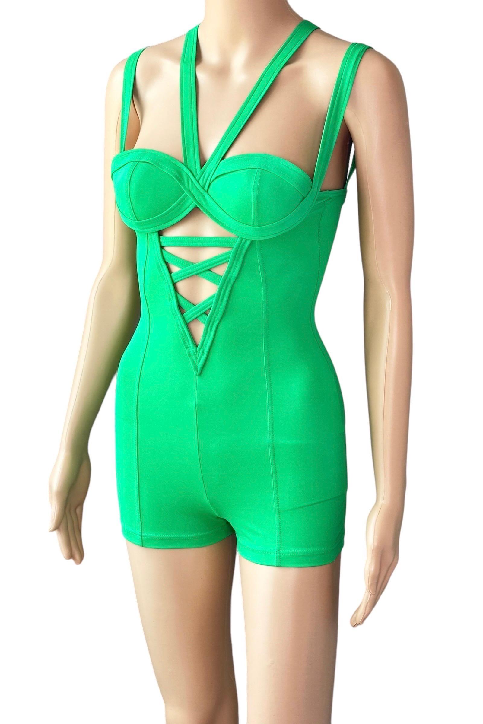 Gianni Versace S/S 1993 Mare Vintage Bustier Cutout Green One-Piece Romper Jumpsuit

Versace Mare green jumpsuit featuring bustier cups with strappy chest detailing and criss cross back.

Condition: Good Vintage Condition. Some loose and broken