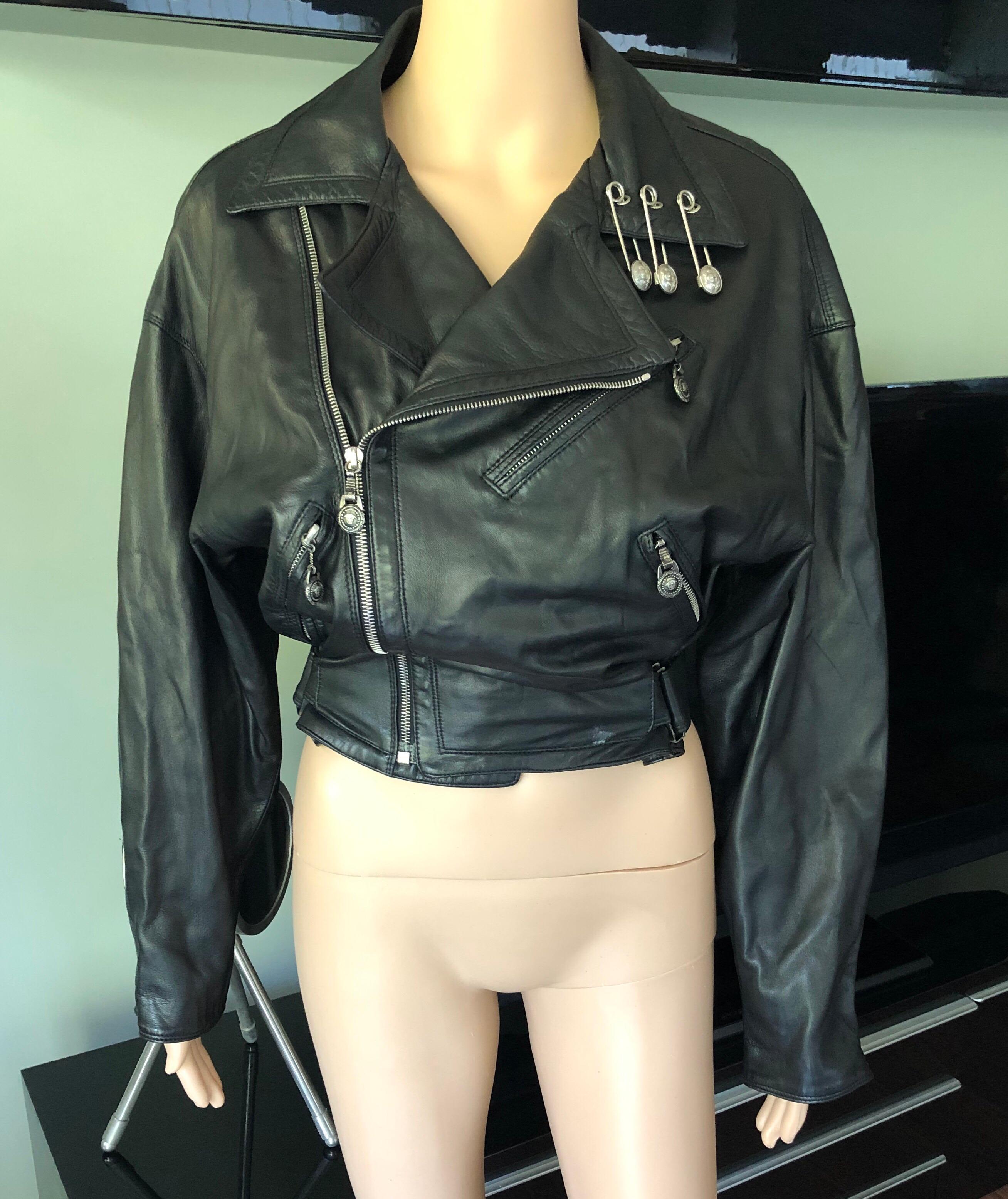 Gianni Versace S/S 1994 Vintage Safety Pins Black Leather Jacket Coat

Black Gianni Versace vintage leather jacket with notched lapel, three pockets and exposed zip closure at front. Please note the size tag has been removed but this jacket will fit