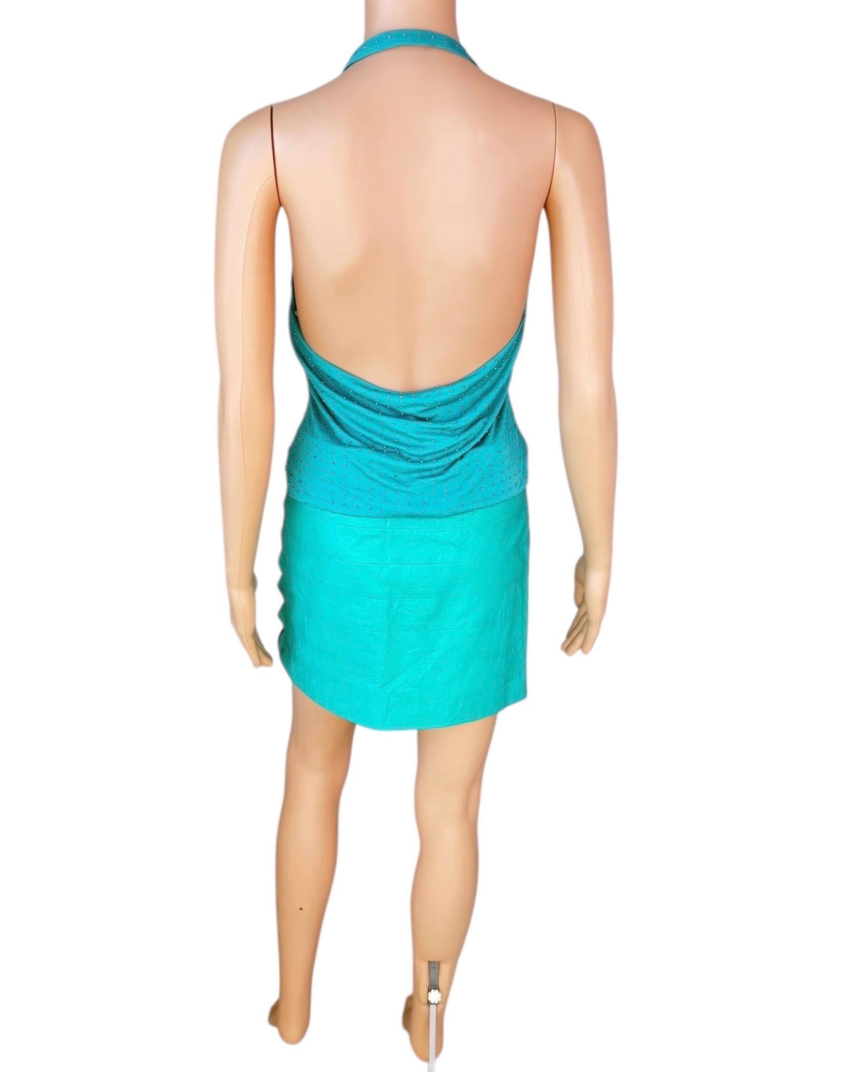 Gianni Versace S/S 2003 Runway Unworn Embellished Halter Backless Top and Leather Cutout Mini Skirt 2 Piece Set Size IT 42

Condition: The top is unworn and it includes the original tags. The skirt is in preowned vintage condition and has natural
