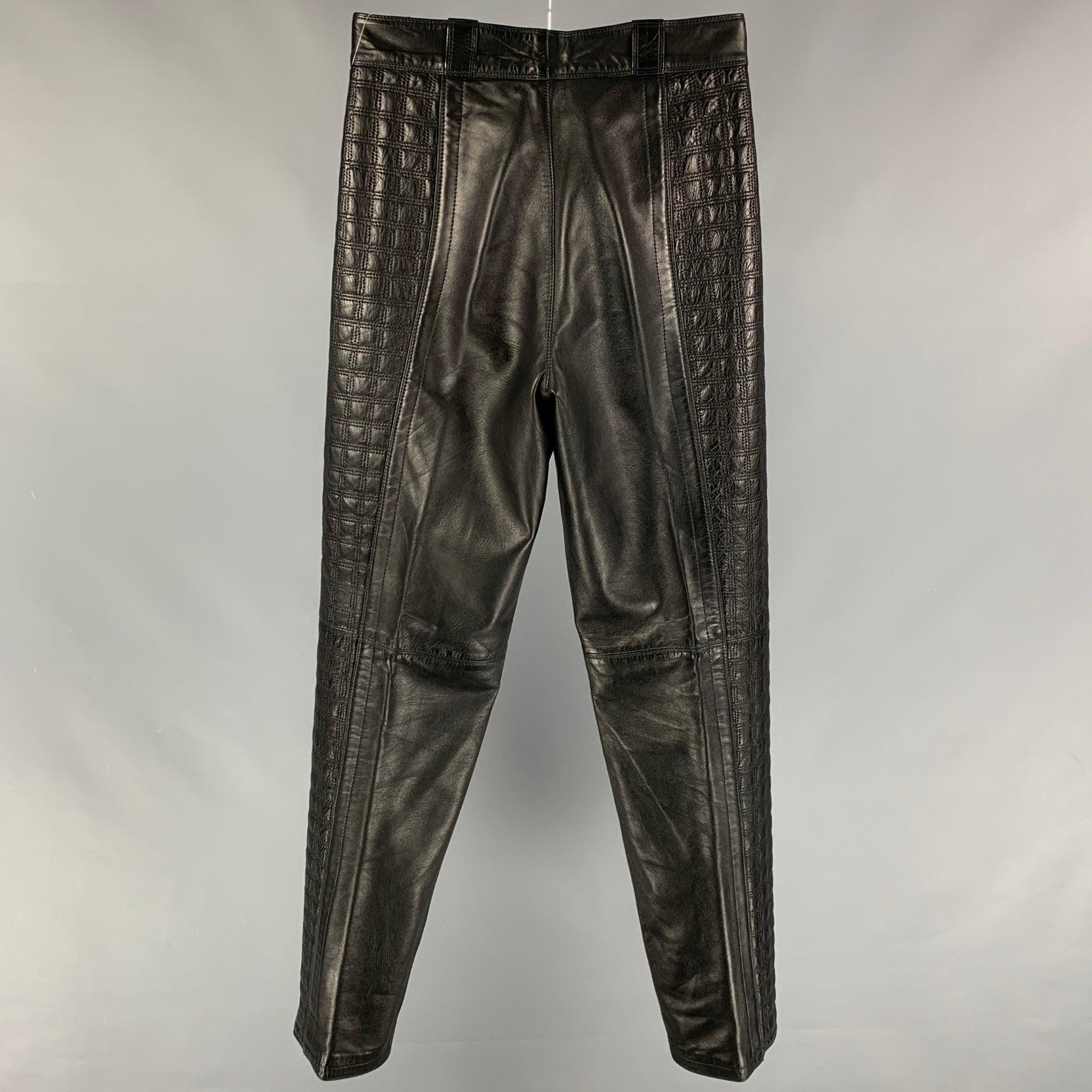 GIANNI VERSACE casual pants comes in a black quilted leather featuring top stitching, pleated front, slit pockets, and a zip fly closure.
Very Good
Pre-Owned Condition. Fabric tag removed.  

Marked:   Size tag removed.  

Measurements: 
  Waist: 29