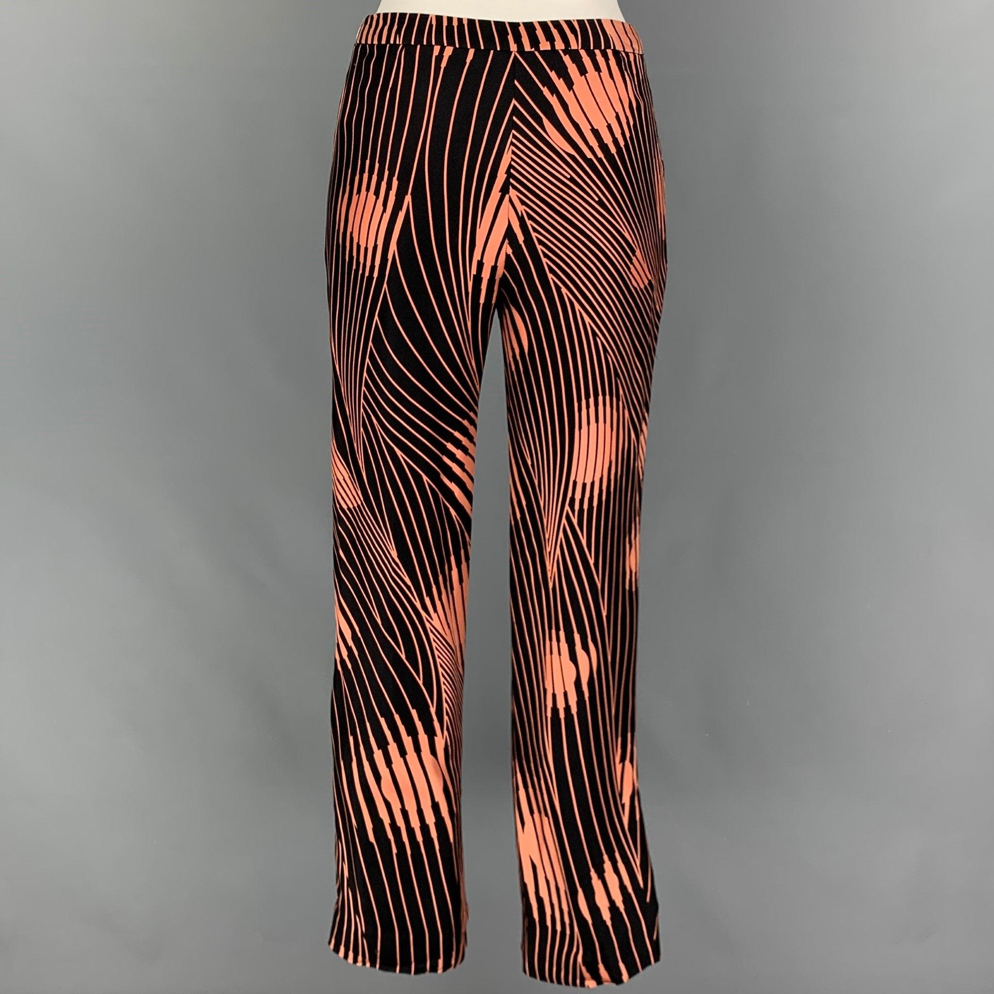 GIANNI VERSACE pants comes in a black & coral abstract print material featuring a flat front, front tab, and a zip fly closure. Made in Italy.
Very Good
Pre-Owned Condition. Fabric tag removed. 

Marked:   40 

Measurements: 
  Waist: 26 inches 