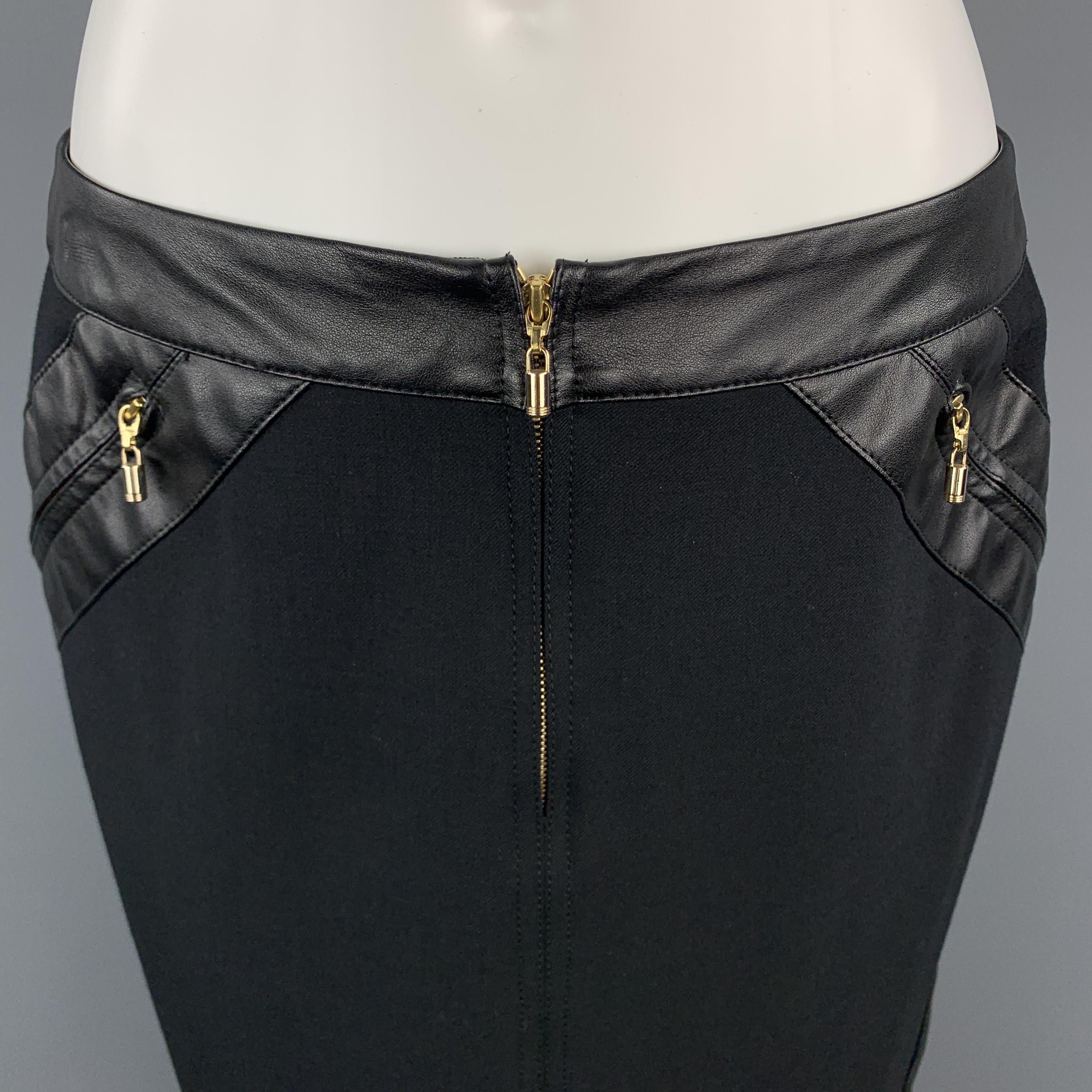 GIANNI VERSACE Pencil Skirt comes in a black solid twill wool blend material, in a knee length, featuring leather trim, gold tone metal zipper, and slit pockets. Made in Italy. 

Excellent Pre-Owned Condition.
Marked: IT 42

Measurements:

Waist: 29