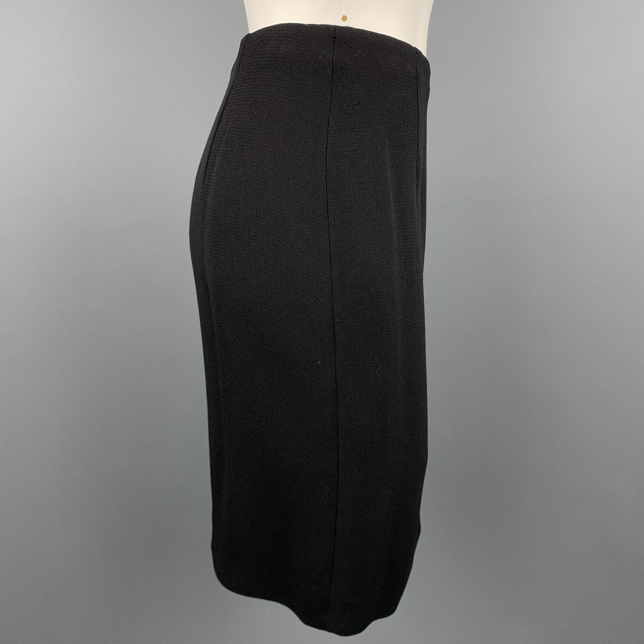 GIANNI VERSACE skirt comes in a black textured material with a black monogram print liner featuring a pencil style and a back zip up closure. Made in Italy.Very Good
Pre-Owned Condition. 

Marked:   IT 42 

Measurements: 
  Waist: 28 inches 
Hip: 36