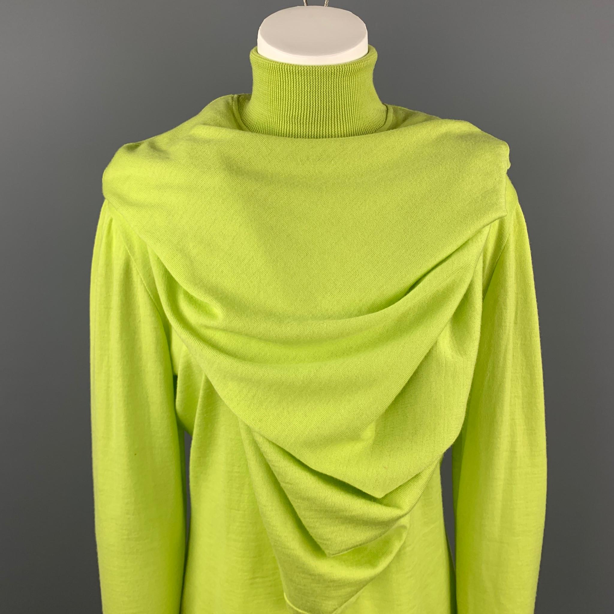 Vintage 1980's GIANNI VERSACE pullover comes in bold light lime green wool with a turtleneck and cape overlay. Made in Italy.

Excellent Pre-Owned Condition.
Marked: III

Measurements:

Shoulder: 18 in.
Bust: 40 in.
Sleeve: 23 in.
Length: 26 in.