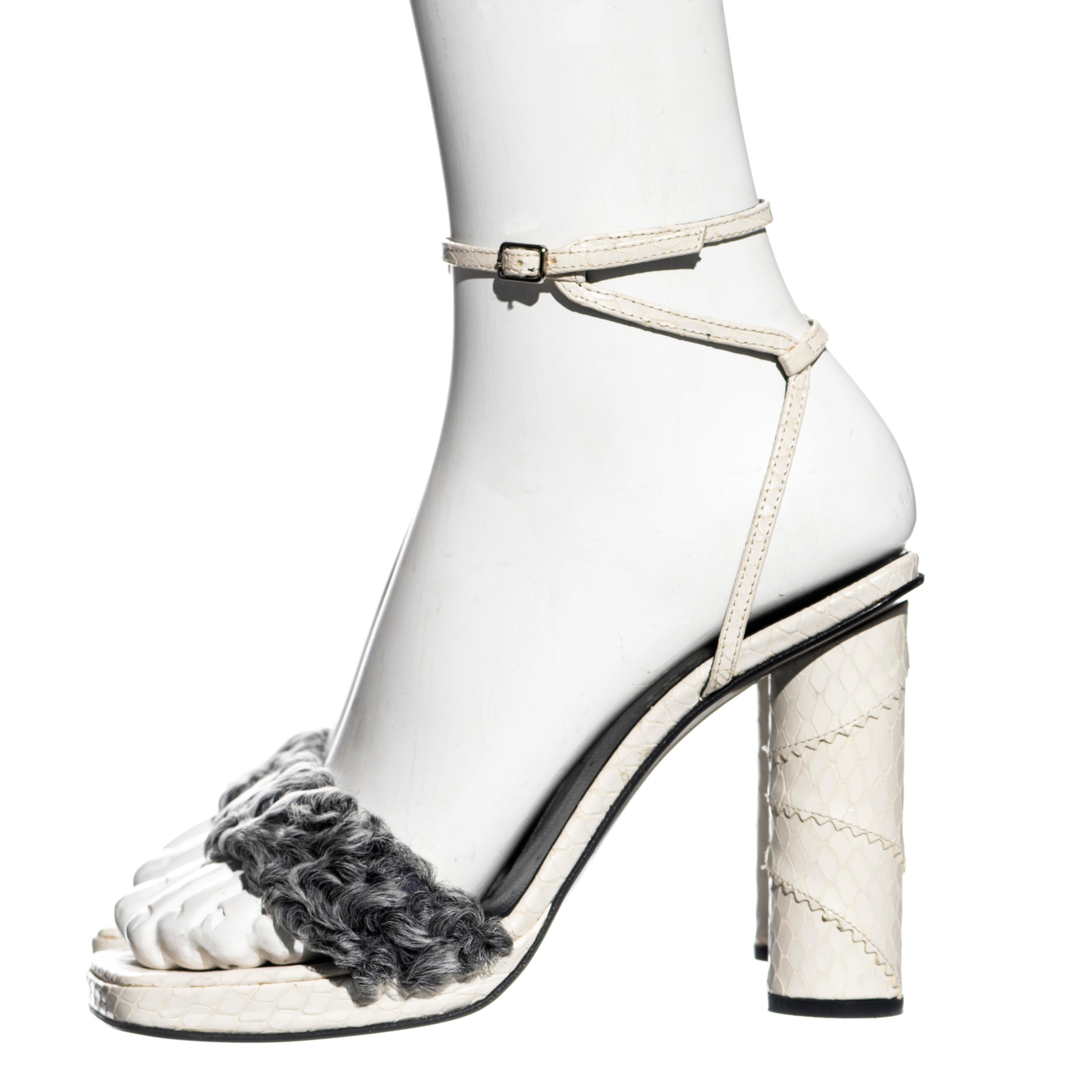 ▪ Gianni Versace platform sandals 
▪ White snakeskin heel, platform and ankle straps 
▪ Grey Persian lamb strap 
▪ Size European 37 
▪ Fall-Winter 1999
▪ Made in Italy