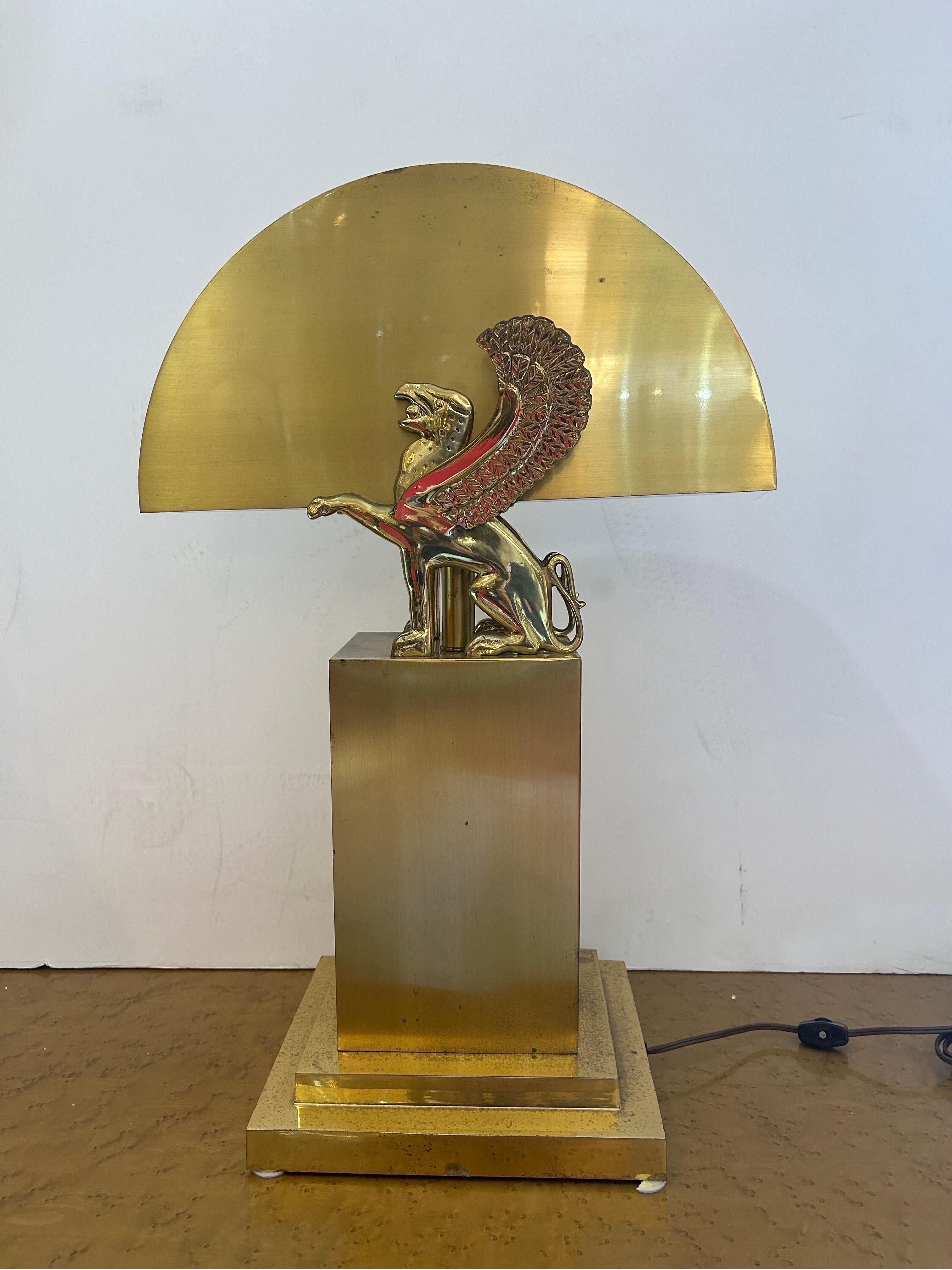 Gianni Versace style brass lamp with wind Griffin circa 1970s… In original condition with age appropriate wear… Lamp shows beautifully a high style lamp