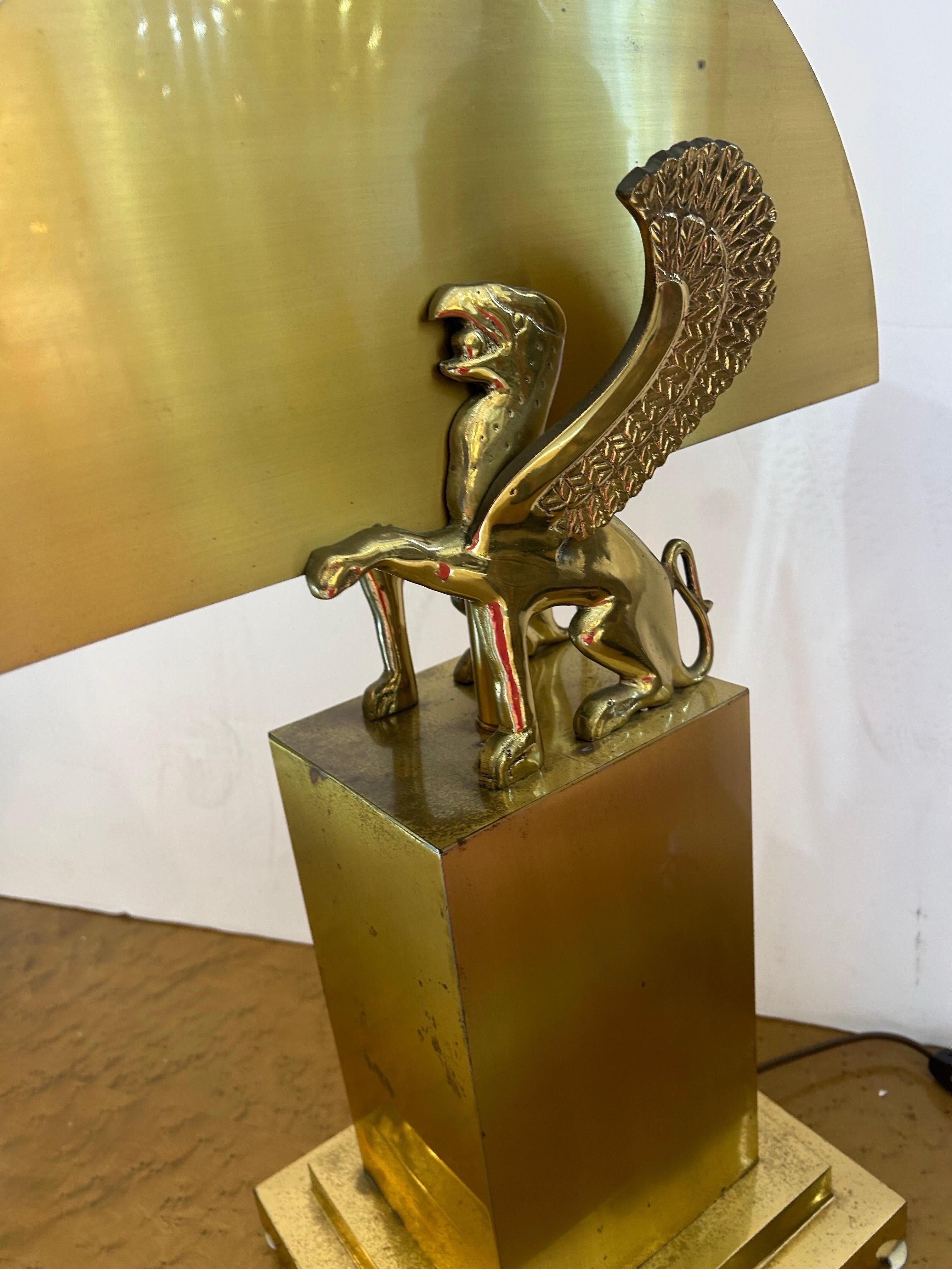 Cast Gianni Versace style brass lamp with winged griffins.. For Sale