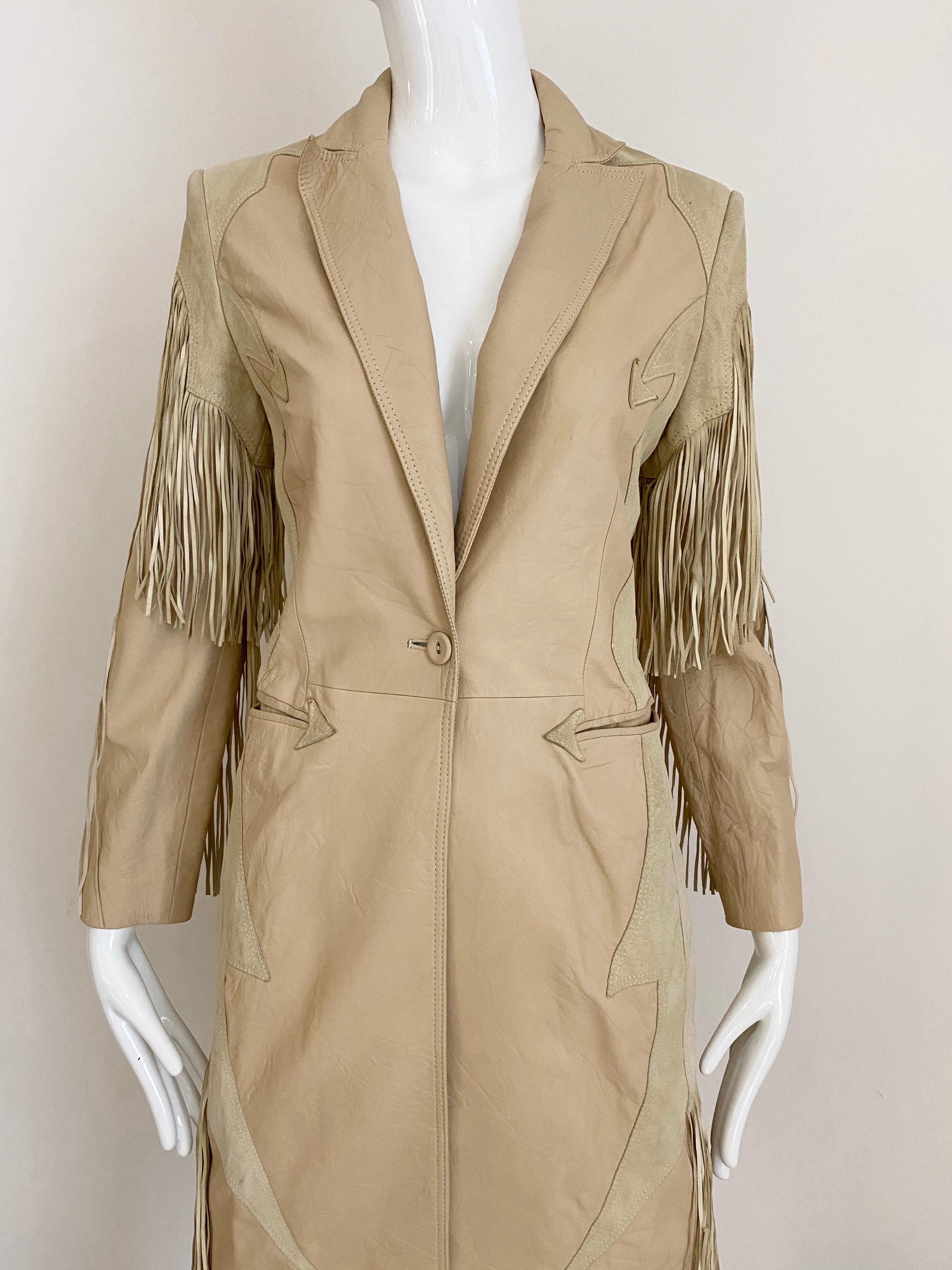2003 Gianni Versace Tan and cream leather suede fringe coat.
Fit size 2/4
